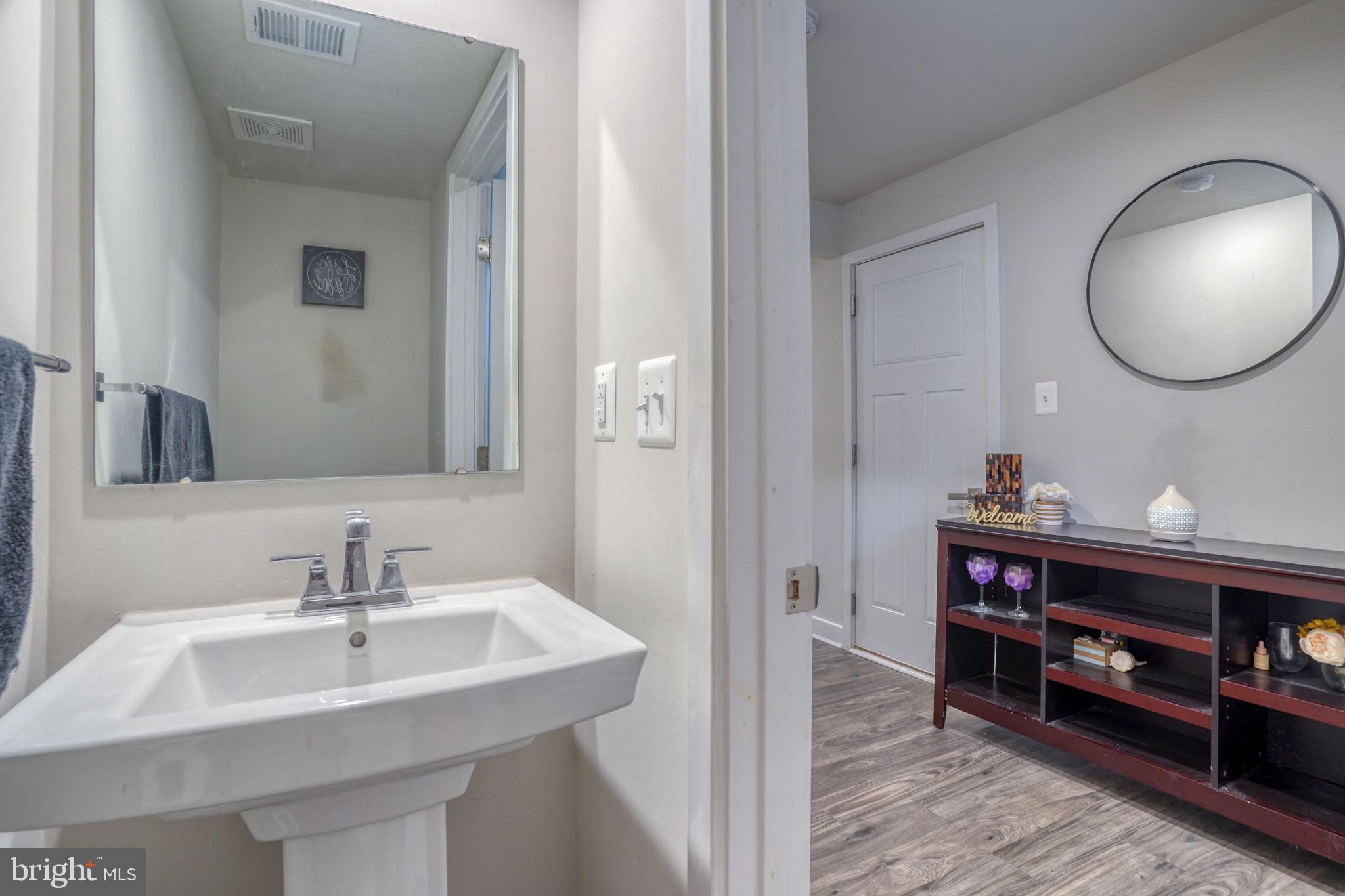 1944 Spearfish Court Newark, DE 19702 - Photo 16 of 44 a en suite bathroom with a sink and a mirror