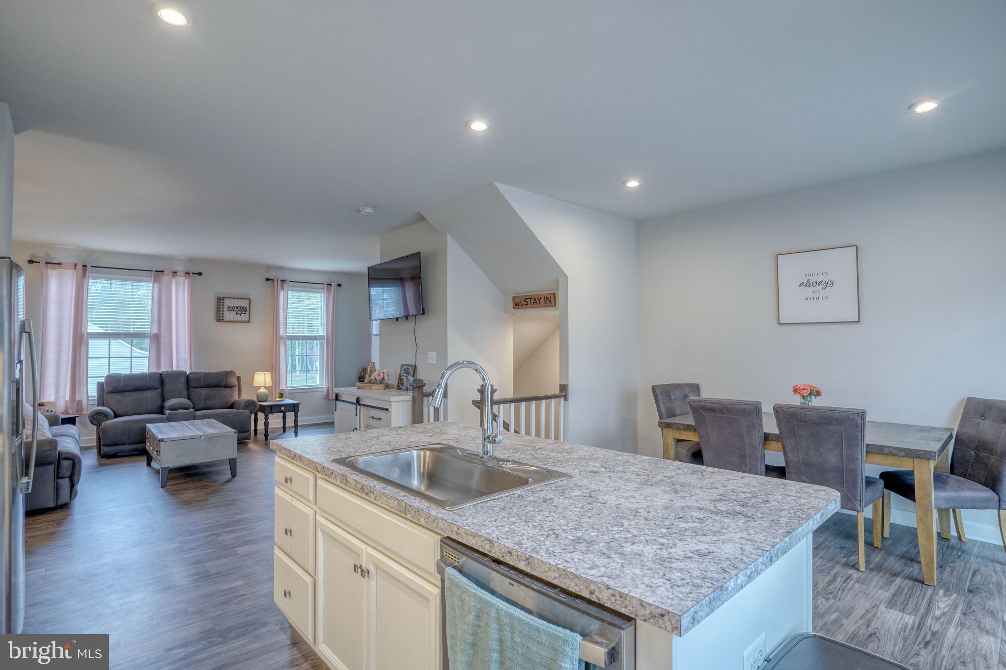 1944 Spearfish Court Newark, DE 19702 - Photo 23 of 44 a kitchen with granite countertop kitchen island a sink table and chairs