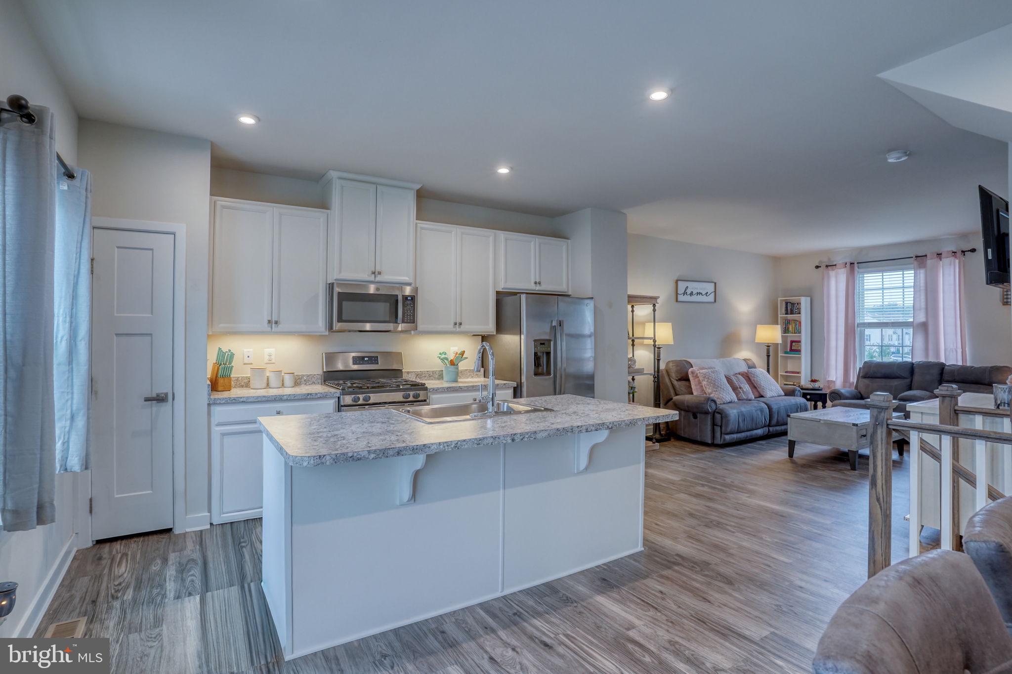 1944 Spearfish Court Newark, DE 19702 - Photo 24 of 44 a large kitchen with stainless steel appliances granite countertop a lot of counter space and wooden floor