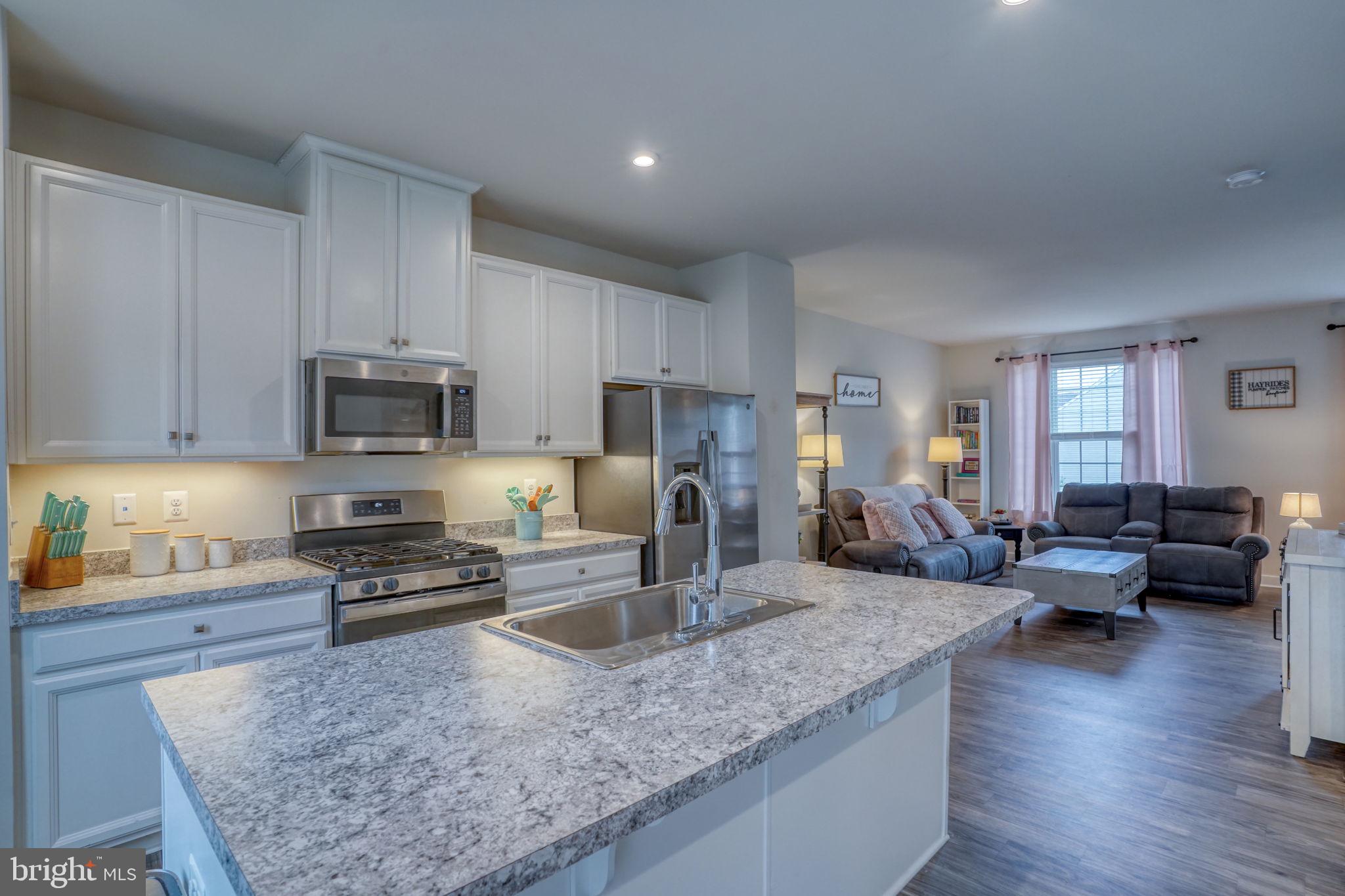 1944 Spearfish Court Newark, DE 19702 - Photo 25 of 44 a kitchen with stainless steel appliances granite countertop a sink dishwasher stove microwave and refrigerator