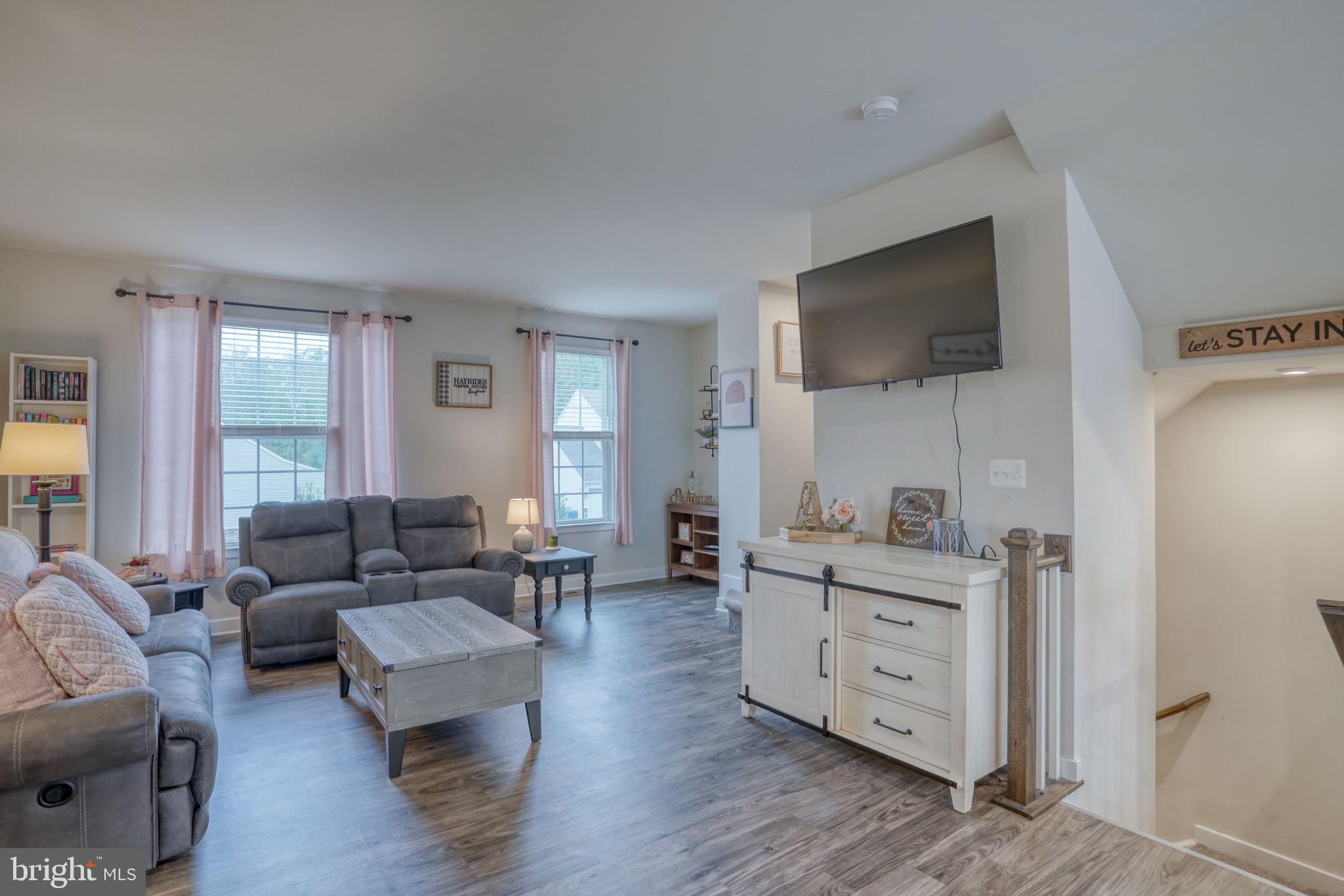1944 Spearfish Court Newark, DE 19702 - Photo 26 of 44 a living room with furniture and a flat screen tv