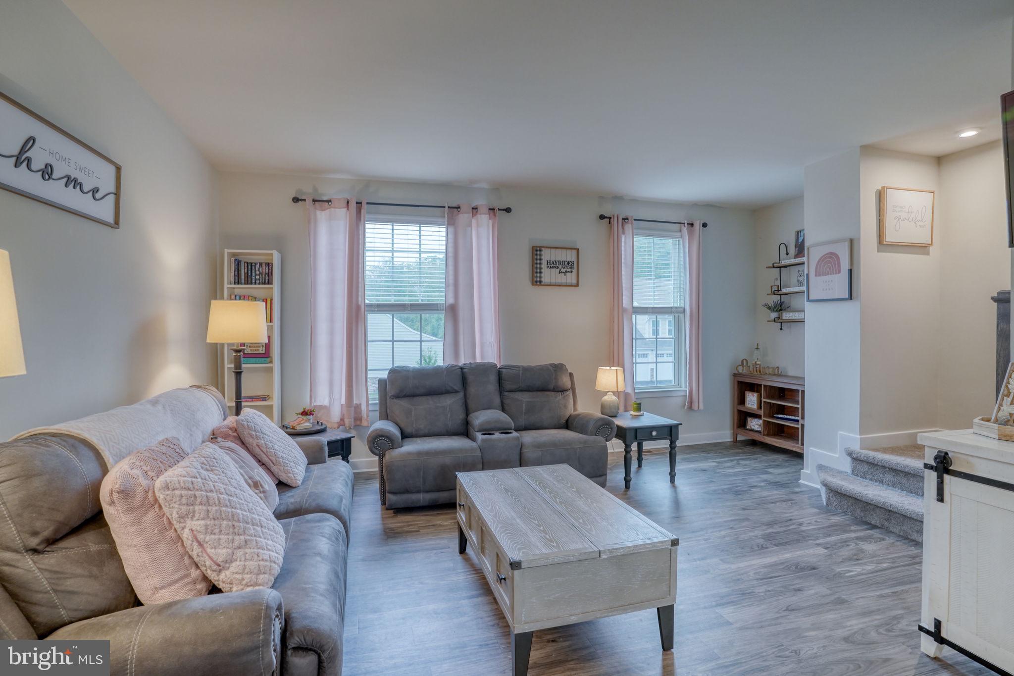 1944 Spearfish Court Newark, DE 19702 - Photo 27 of 44 a living room with furniture and a fireplace