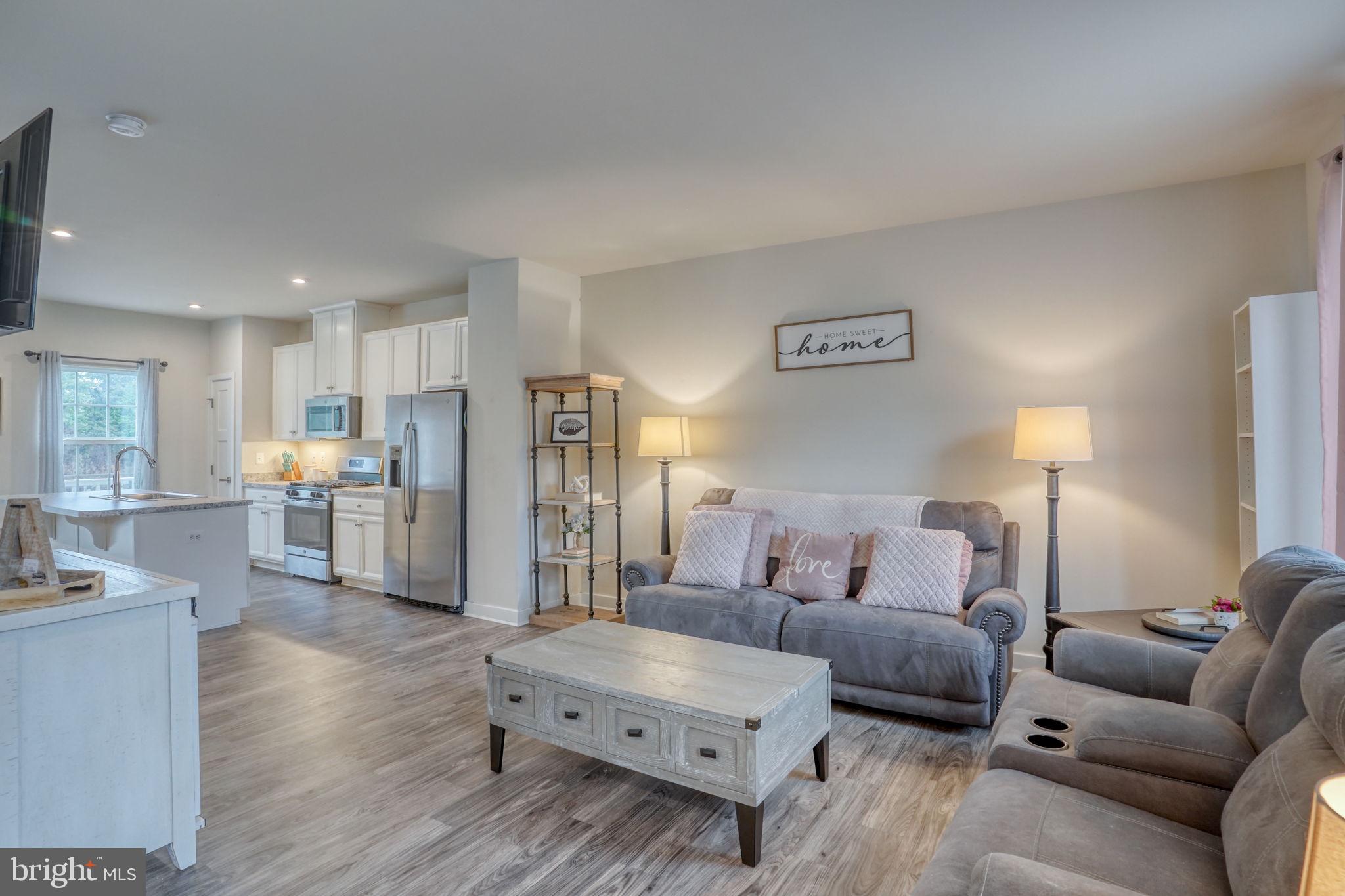 1944 Spearfish Court Newark, DE 19702 - Photo 29 of 44 a living room with furniture and a wooden floor