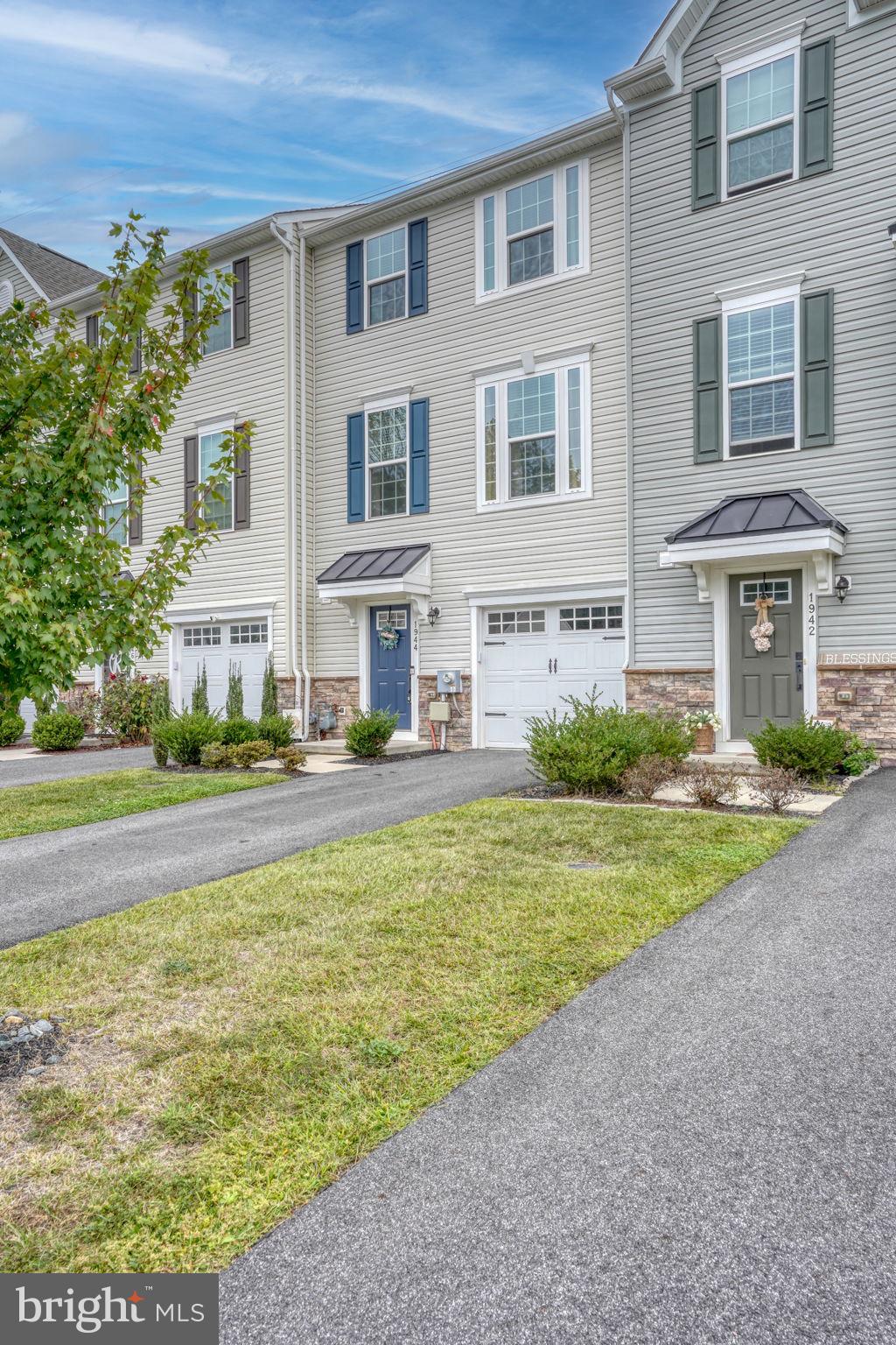 1944 Spearfish Court Newark, DE 19702 - Photo 3 of 44 a front view of a house with a yard and lake view