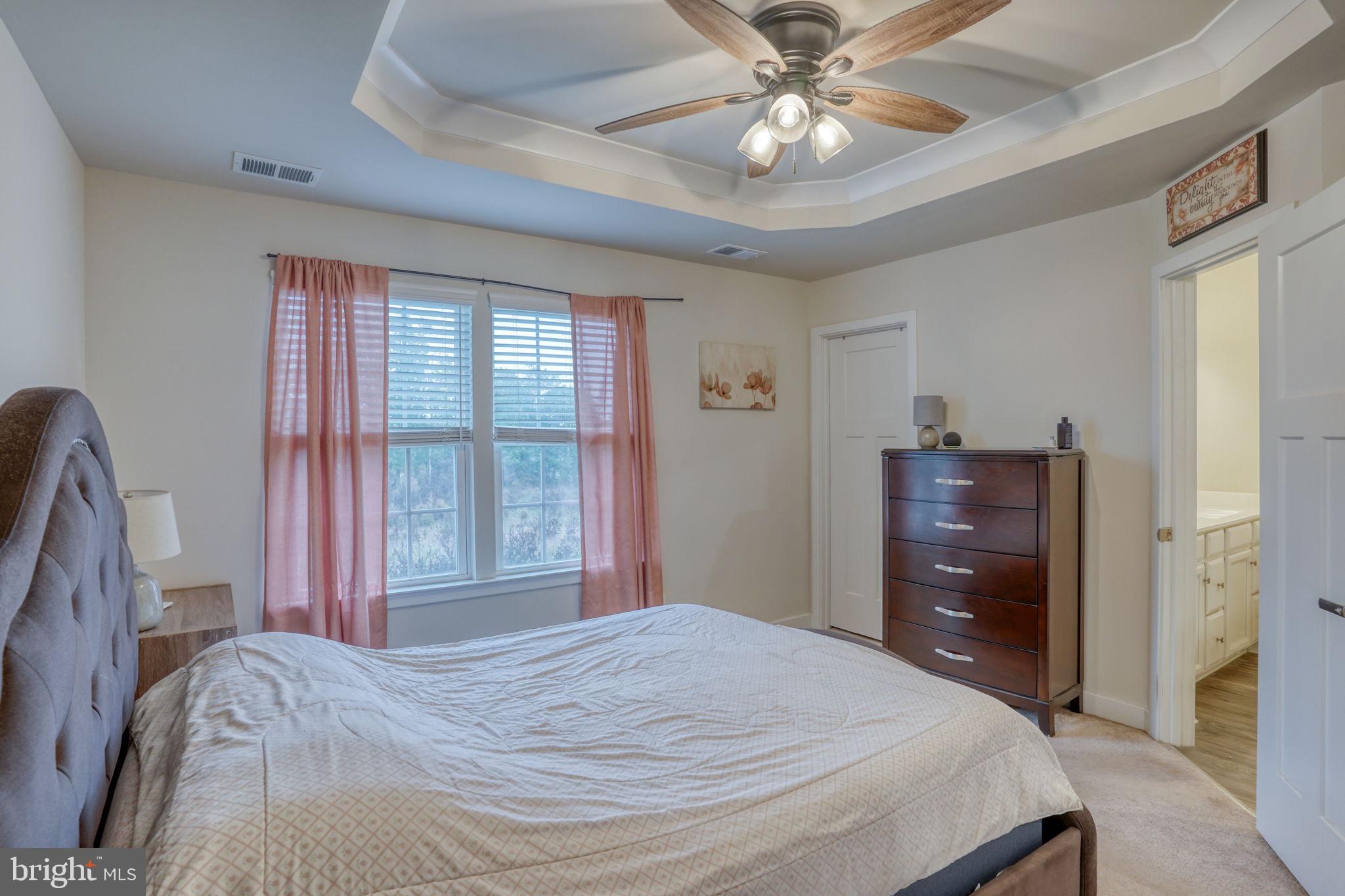 1944 Spearfish Court Newark, DE 19702 - Photo 33 of 44 a bedroom with a bed and a chandelier