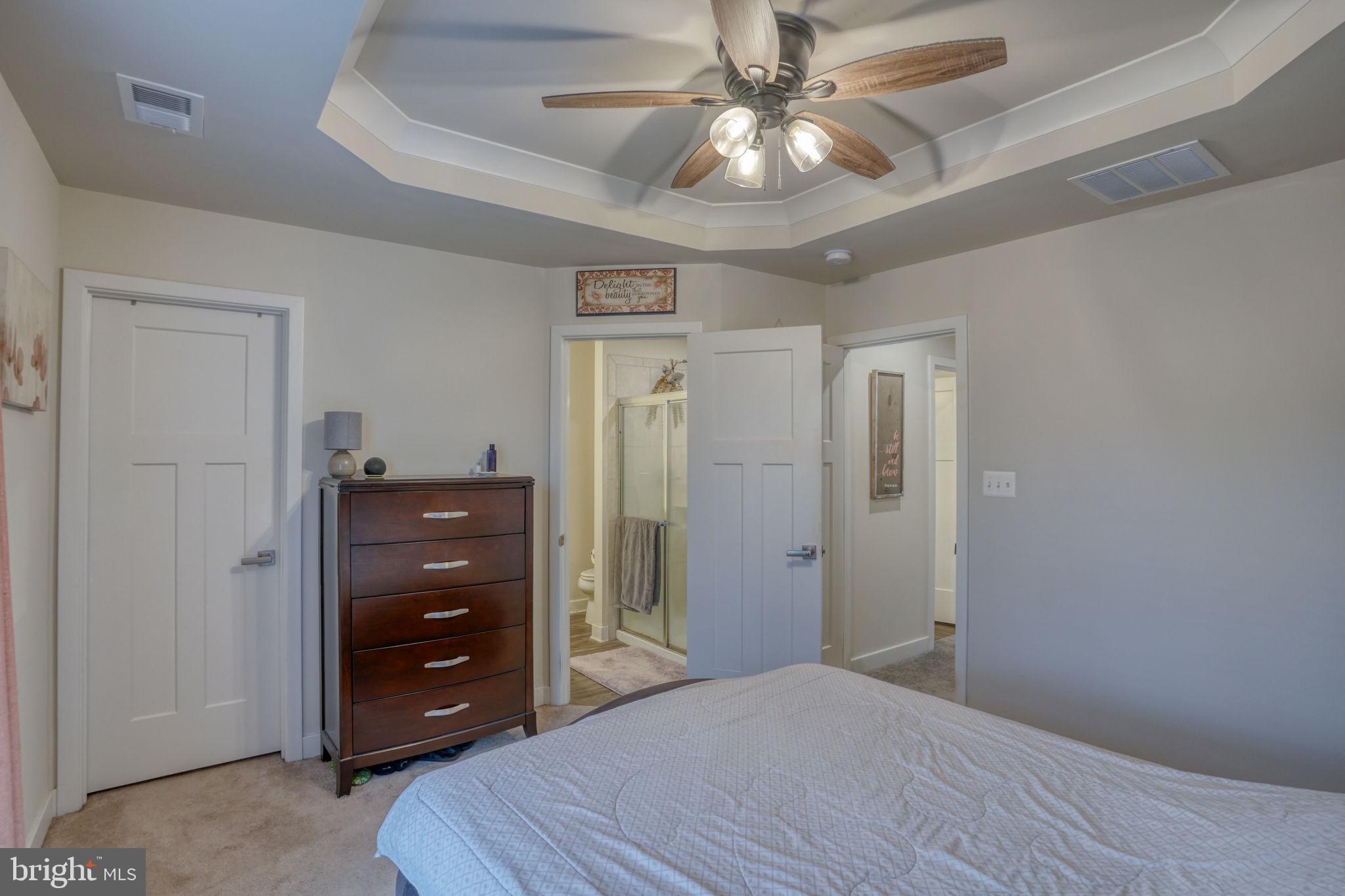 1944 Spearfish Court Newark, DE 19702 - Photo 34 of 44 a bedroom with a bed and a ceiling fan