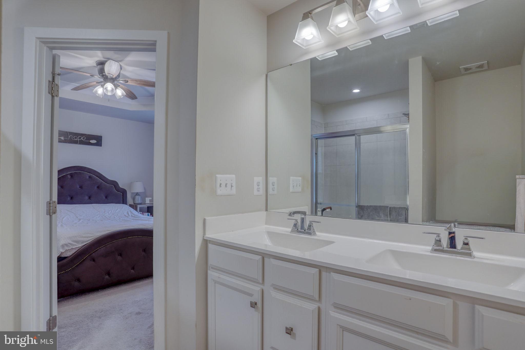 1944 Spearfish Court Newark, DE 19702 - Photo 35 of 44 a en suite bathroom with a double vanity sink and a mirror