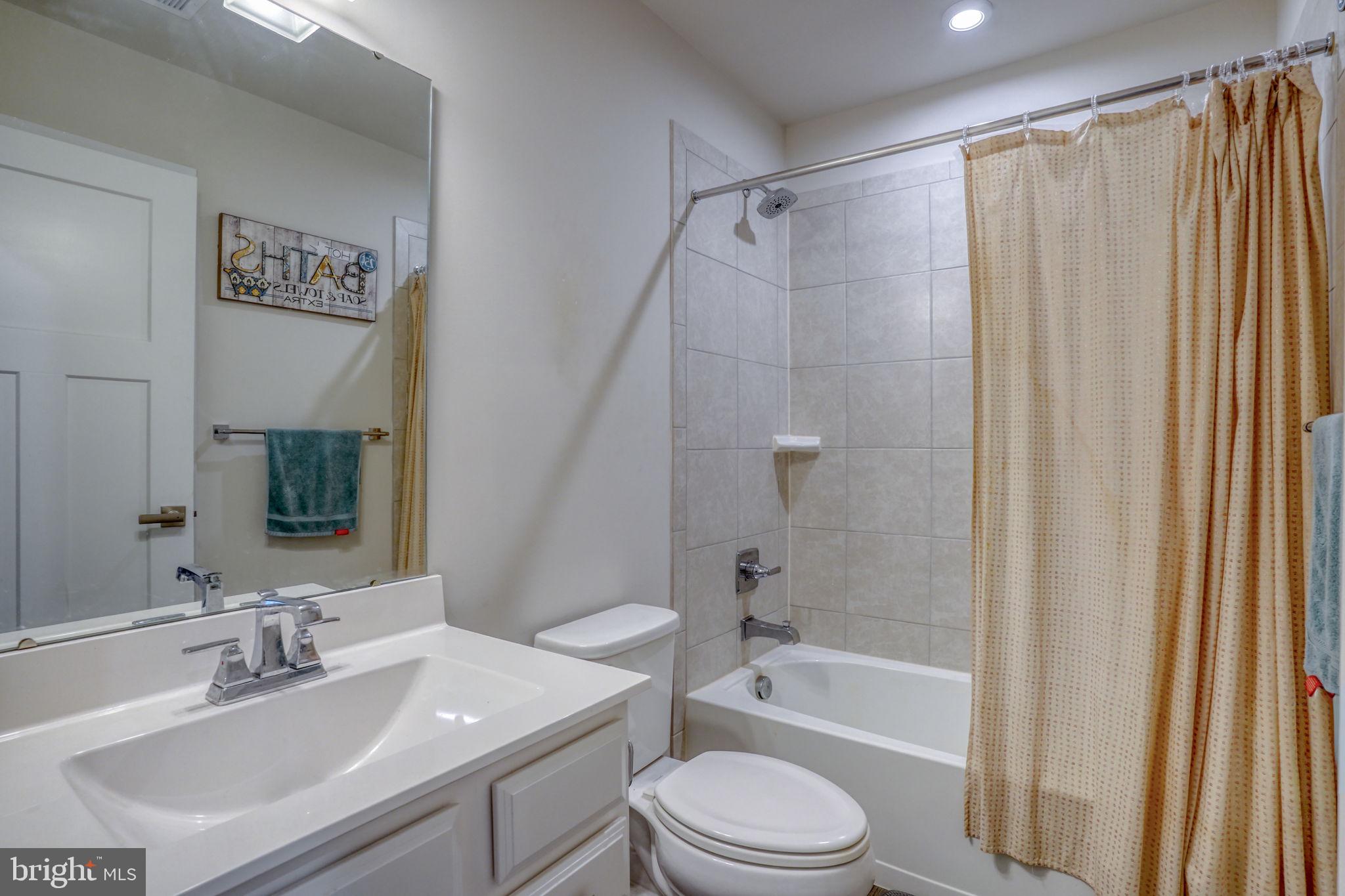 1944 Spearfish Court Newark, DE 19702 - Photo 40 of 44 a bathroom with a sink a toilet and shower