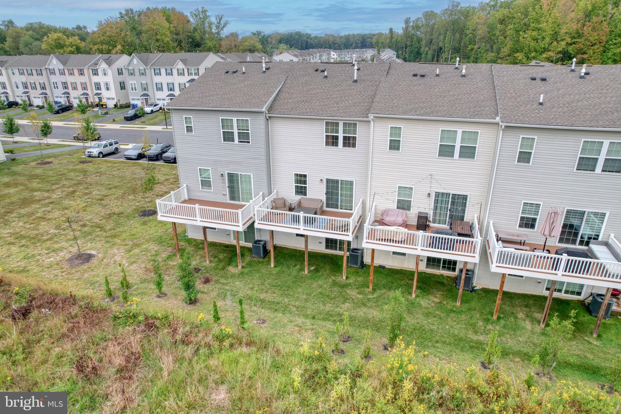 1944 Spearfish Court Newark, DE 19702 - Photo 4 of 44 a backyard of a house with wooden floor and outdoor seating