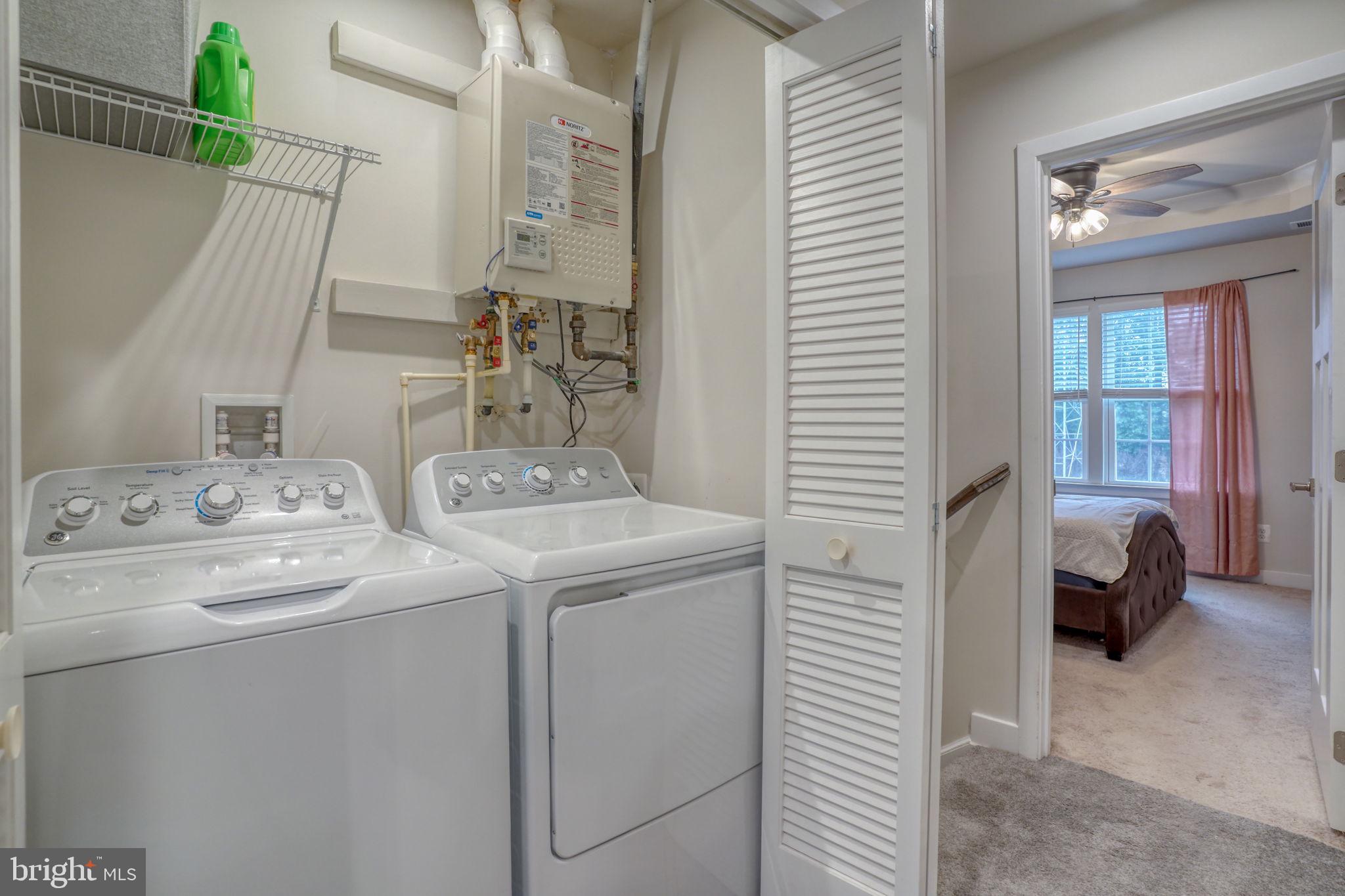 1944 Spearfish Court Newark, DE 19702 - Photo 41 of 44 a utility room with dryer and washer
