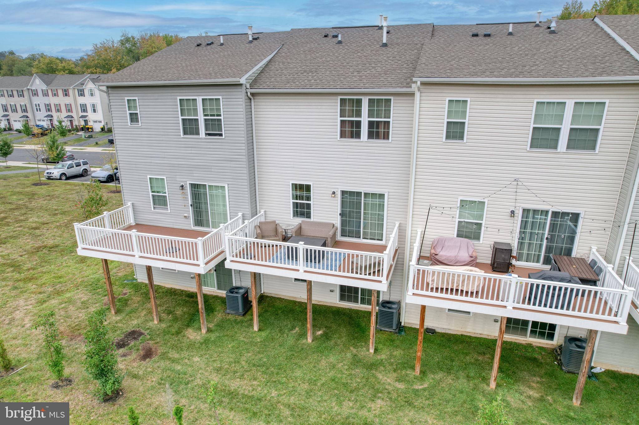 1944 Spearfish Court Newark, DE 19702 - Photo 5 of 44 a balcony with a table and chairs and a yard