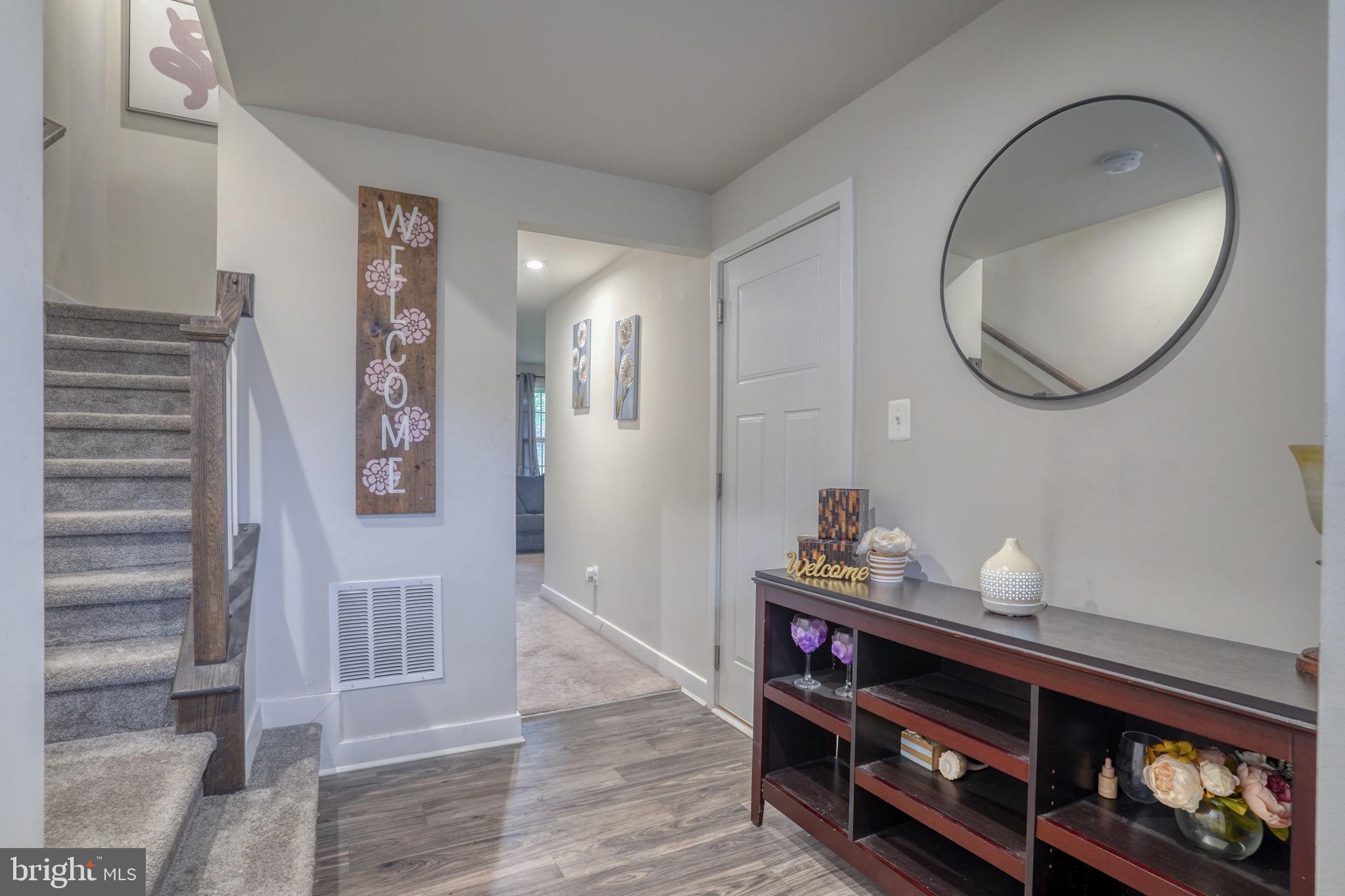 1944 Spearfish Court Newark, DE 19702 - Photo 9 of 44 a view of a hallway with wooden floor and staircase