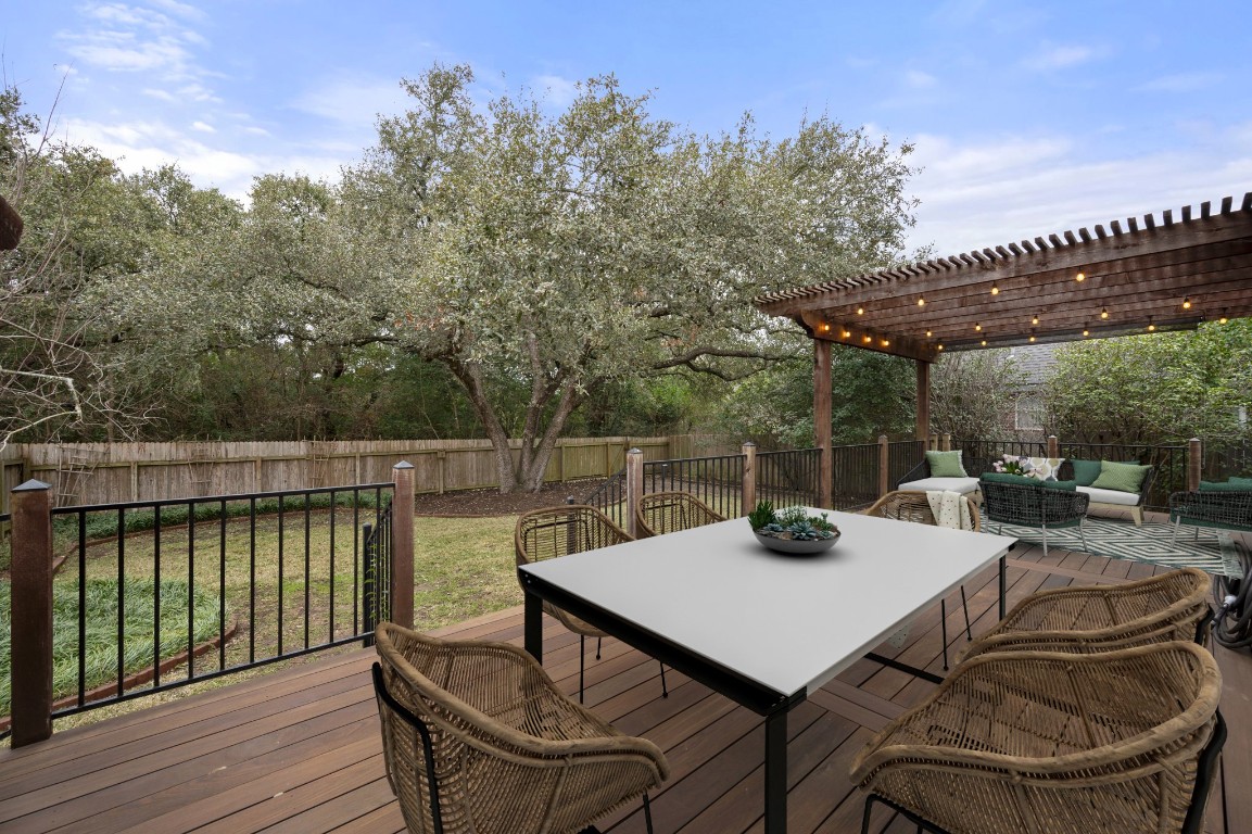 a view of a patio with iron fence