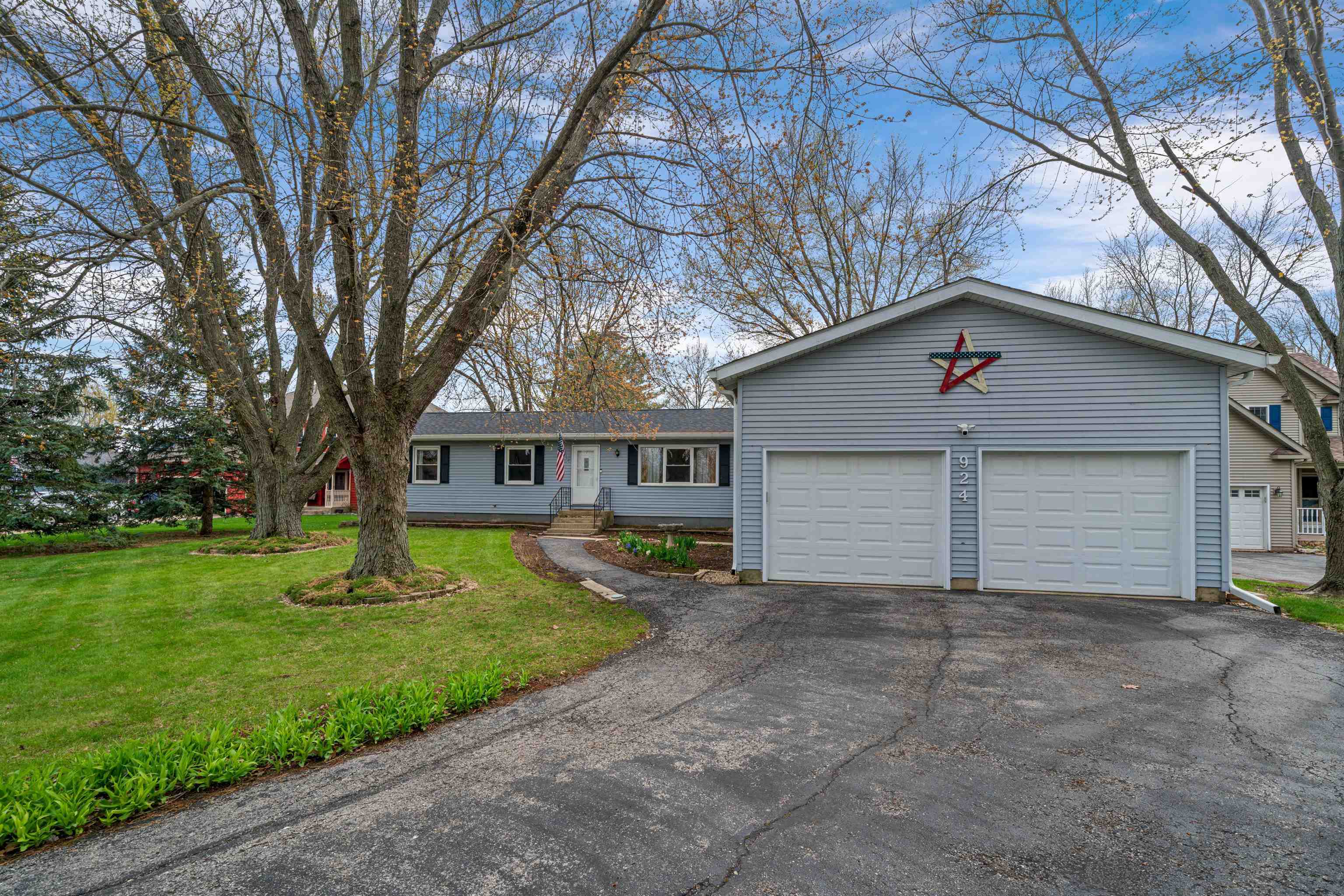 924 Suzy Street Sandwich, IL 60548 - Photo 1 of 48 a view of a house with a yard and large tree