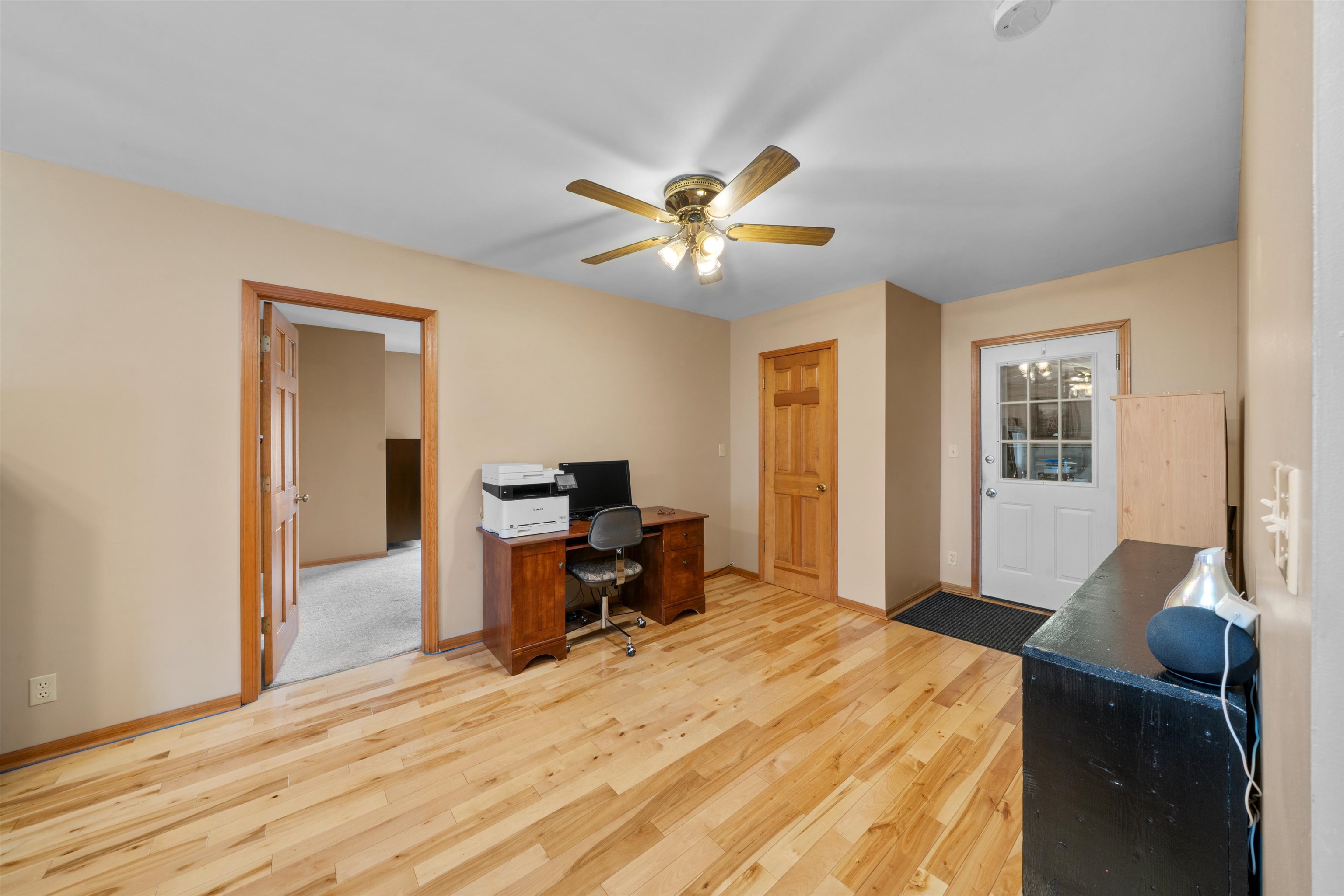 924 Suzy Street Sandwich, IL 60548 - Photo 11 of 48 a bedroom with a bed and a chandelier