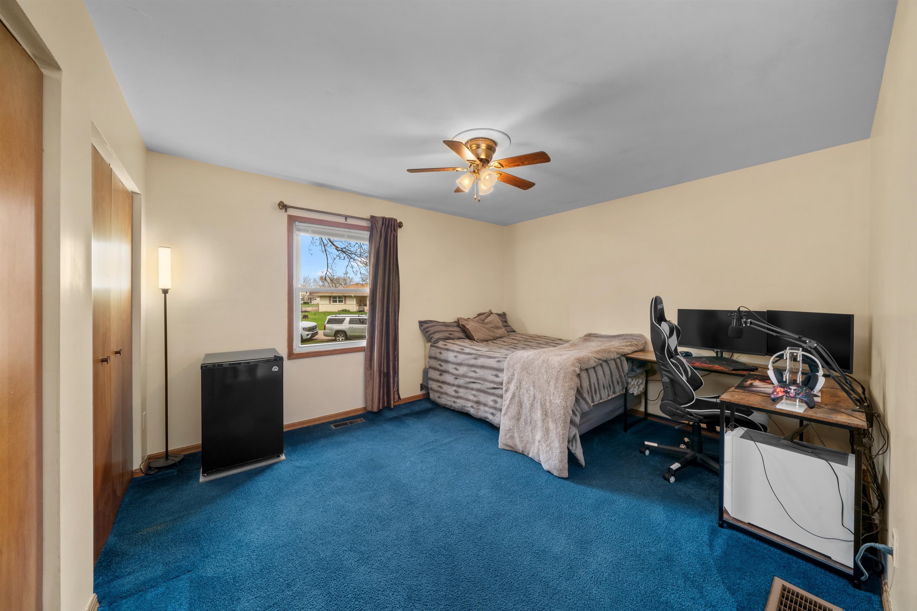 924 Suzy Street Sandwich, IL 60548 - Photo 18 of 48 a spacious bedroom with a bed and a chandelier