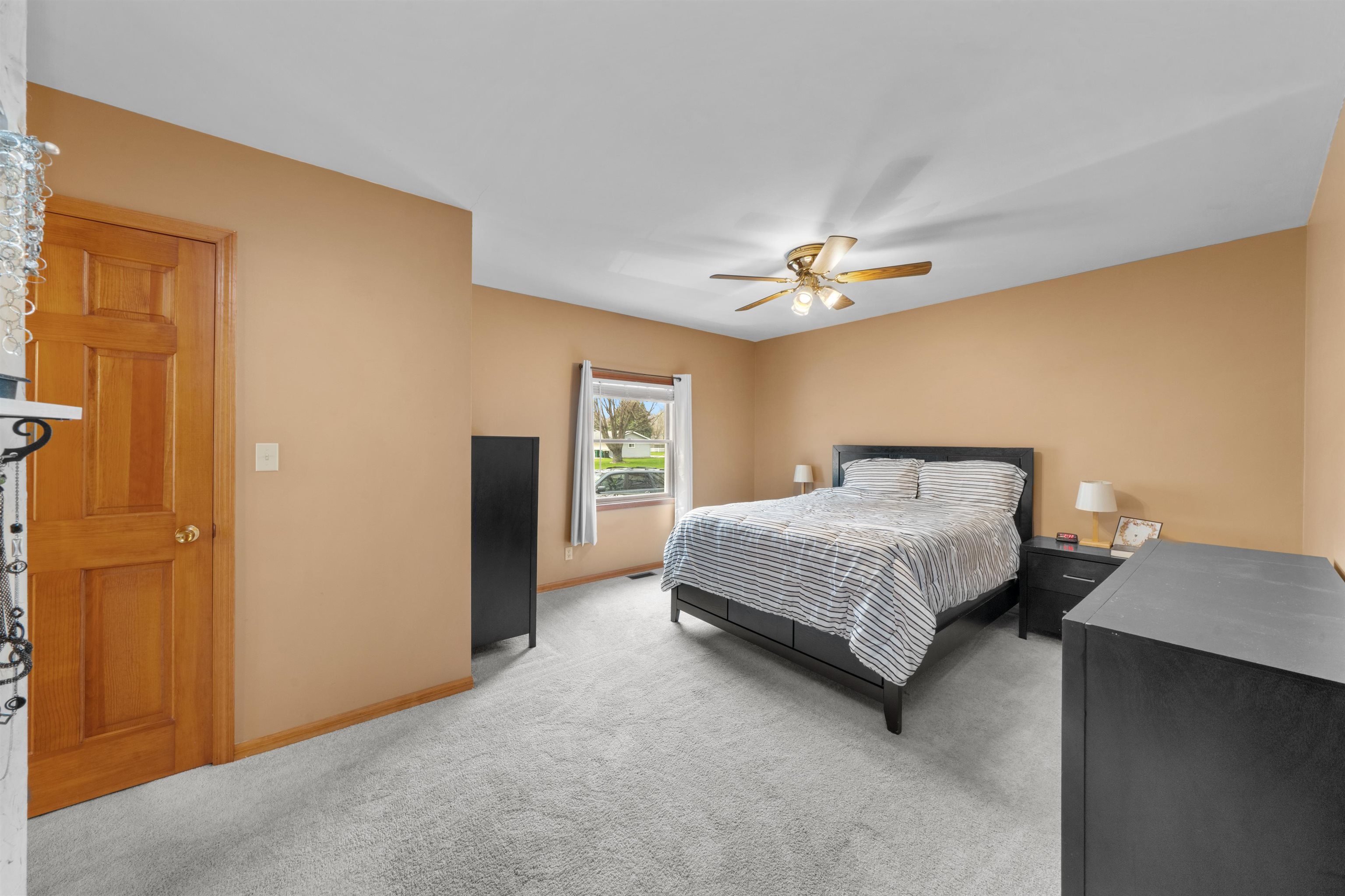 924 Suzy Street Sandwich, IL 60548 - Photo 19 of 48 a bedroom with a bed and a ceiling fan