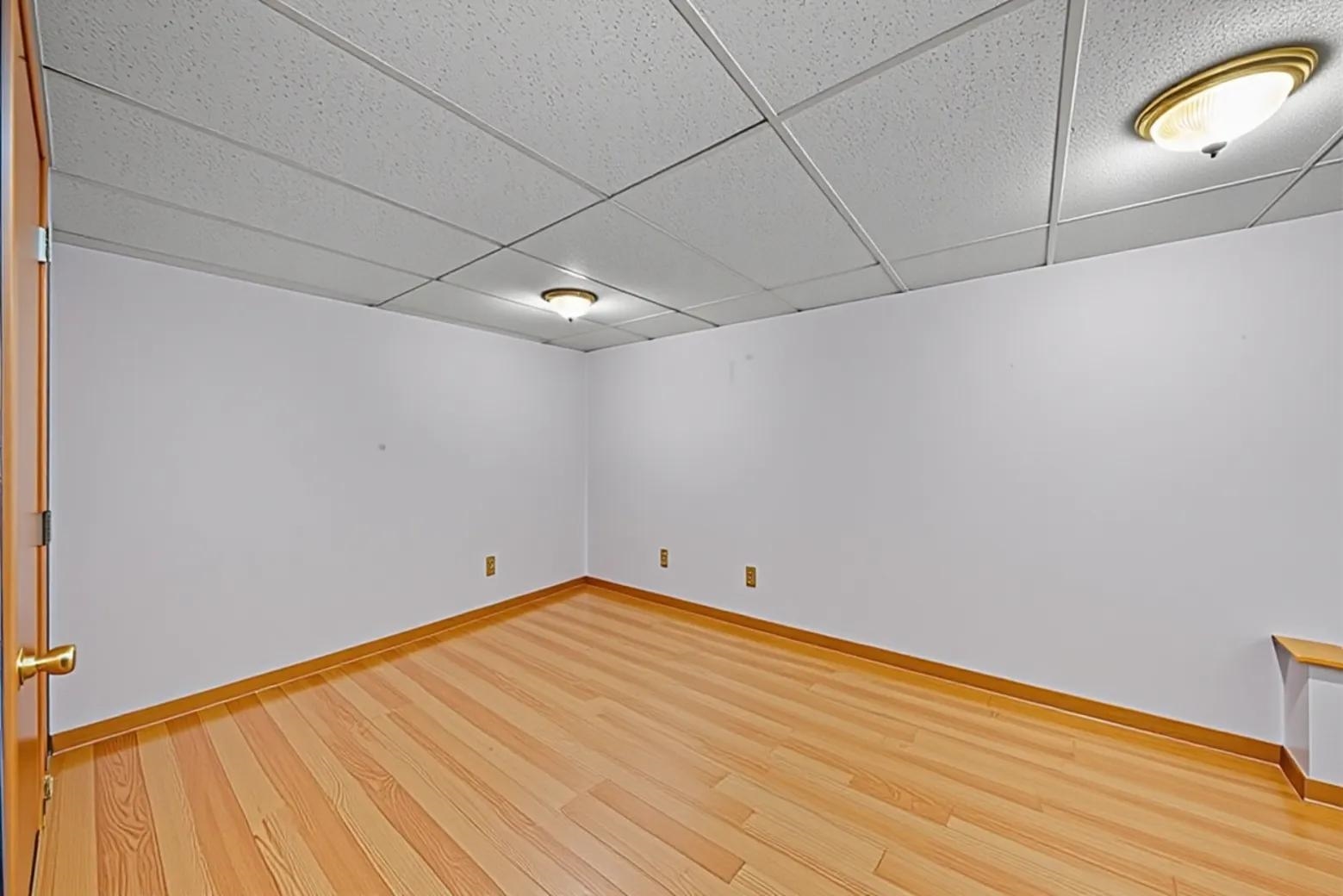 924 Suzy Street Sandwich, IL 60548 - Photo 27 of 48 a view of empty room with wooden floor