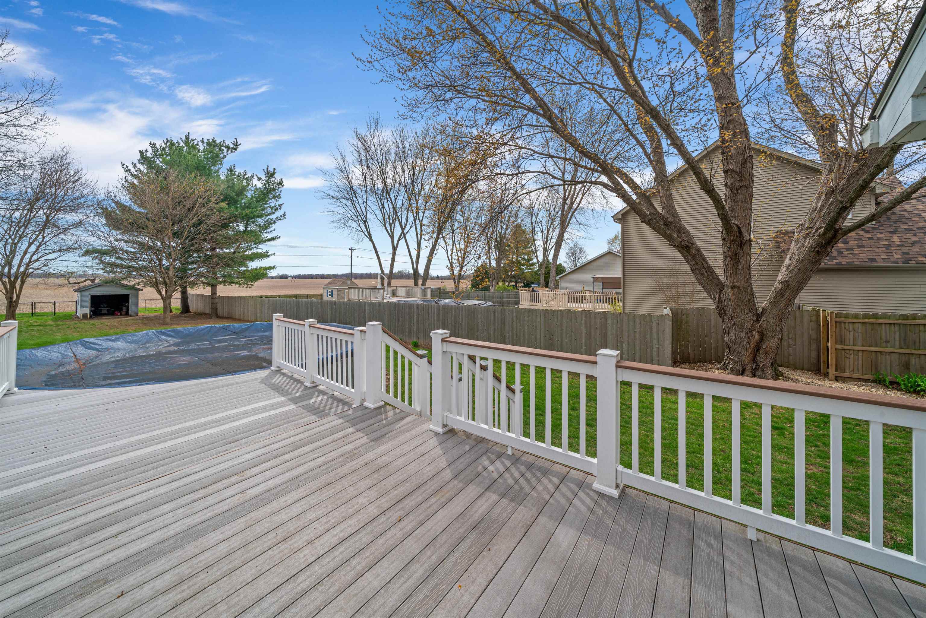 924 Suzy Street Sandwich, IL 60548 - Photo 35 of 48 a view of a wooden deck with trees