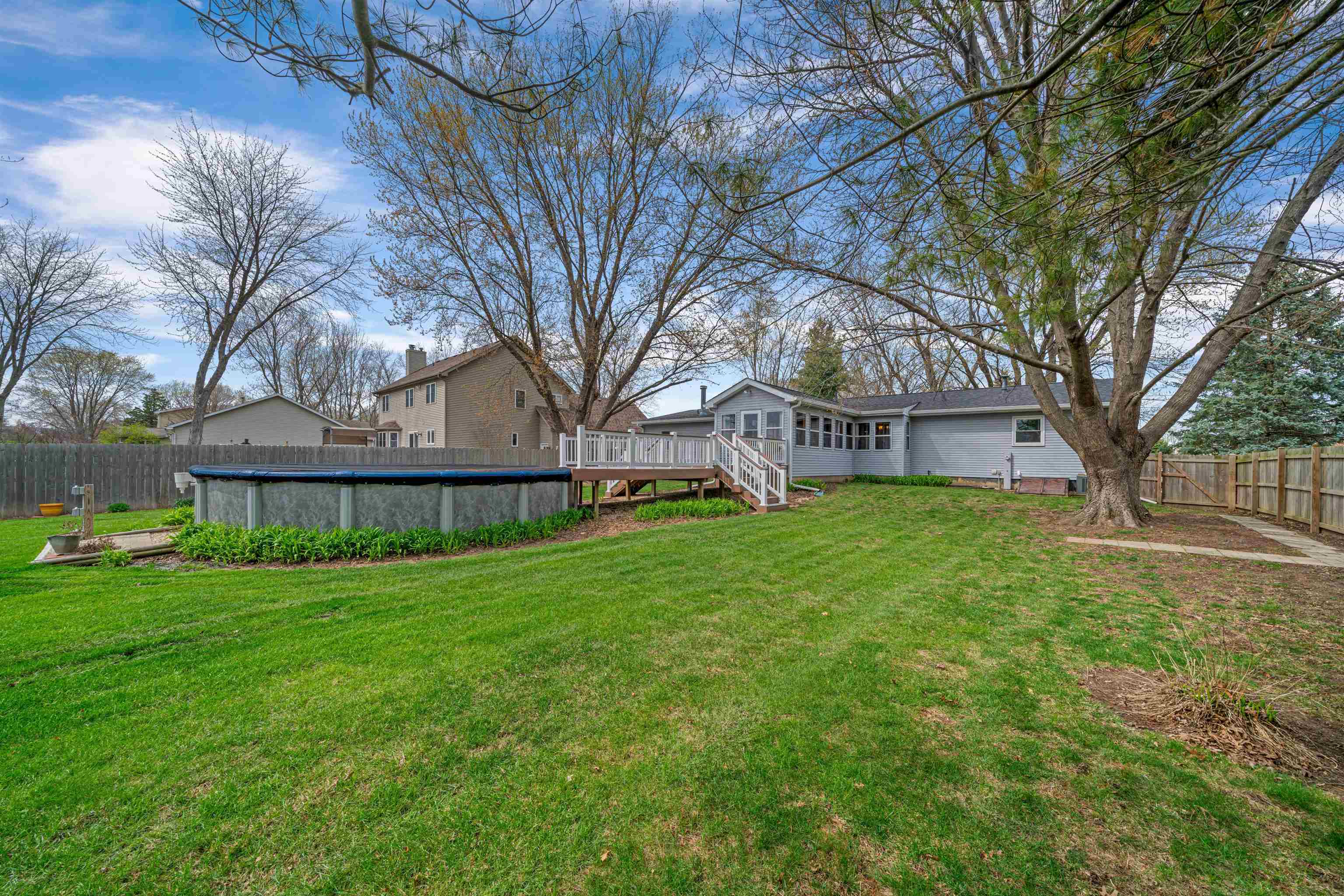 924 Suzy Street Sandwich, IL 60548 - Photo 39 of 48 a view of a house with backyard and a tree
