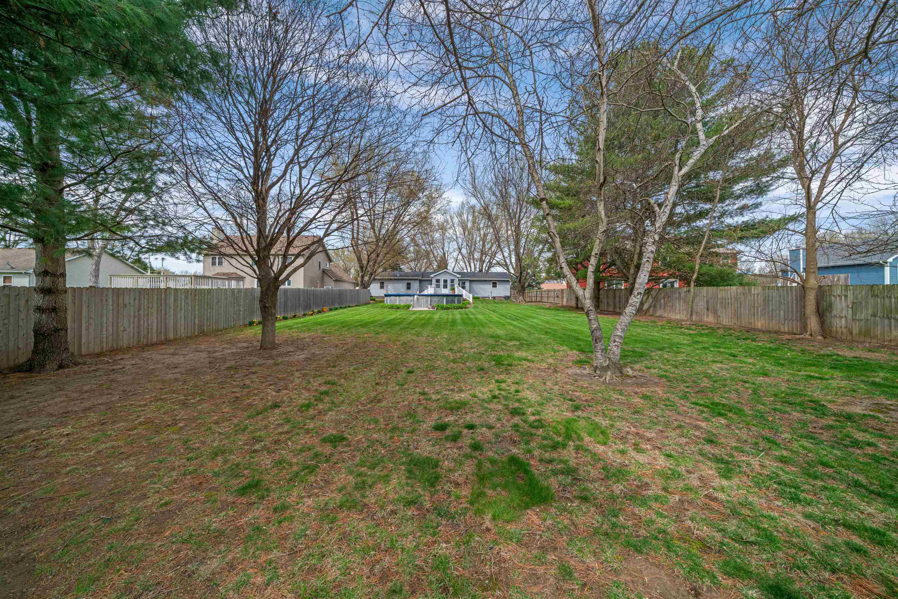 924 Suzy Street Sandwich, IL 60548 - Photo 42 of 48 a backyard of a house with large trees