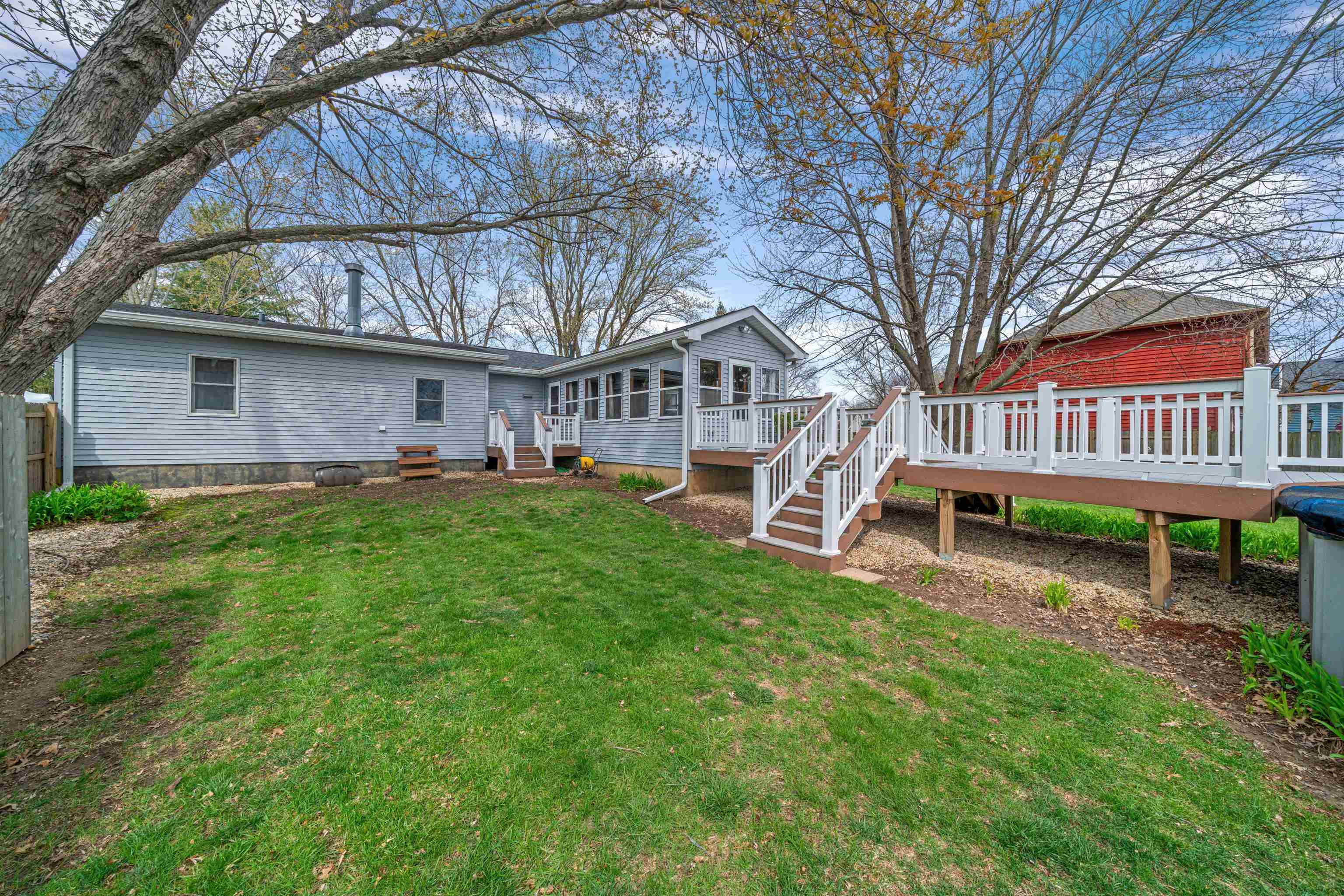 924 Suzy Street Sandwich, IL 60548 - Photo 45 of 48 a view of a house with a yard porch and sitting area