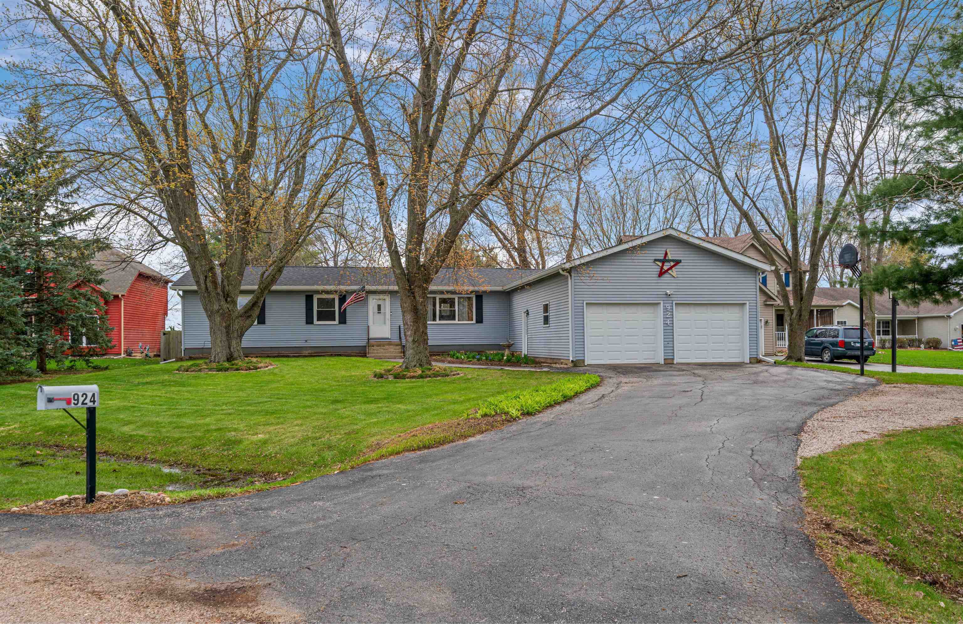 924 Suzy Street Sandwich, IL 60548 - Photo 48 of 48 a front view of a house with a yard and garage