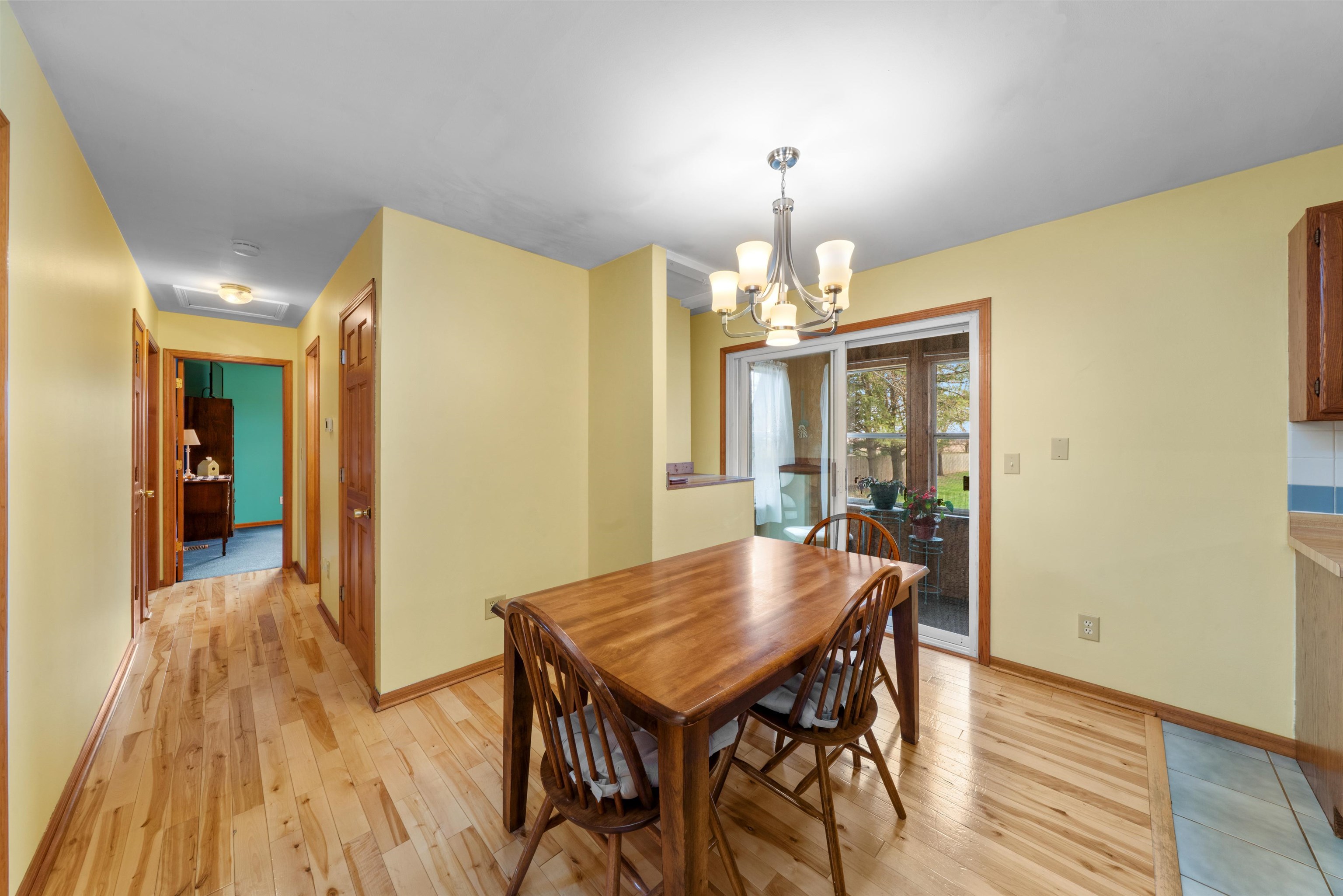 924 Suzy Street Sandwich, IL 60548 - Photo 5 of 48 a view of a dining room with furniture and wooden floor