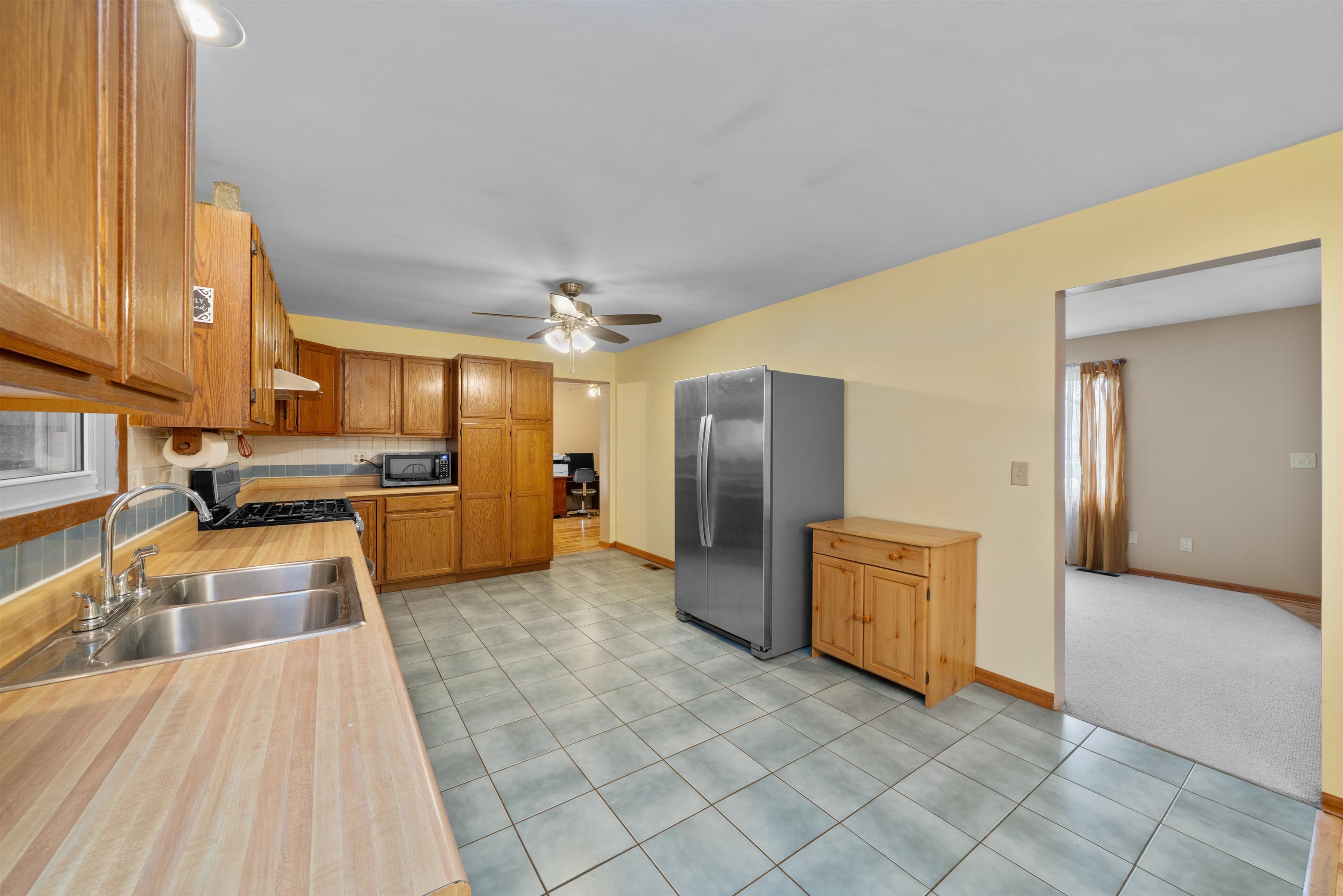 924 Suzy Street Sandwich, IL 60548 - Photo 7 of 48 a kitchen with stainless steel appliances granite countertop a refrigerator and a sink