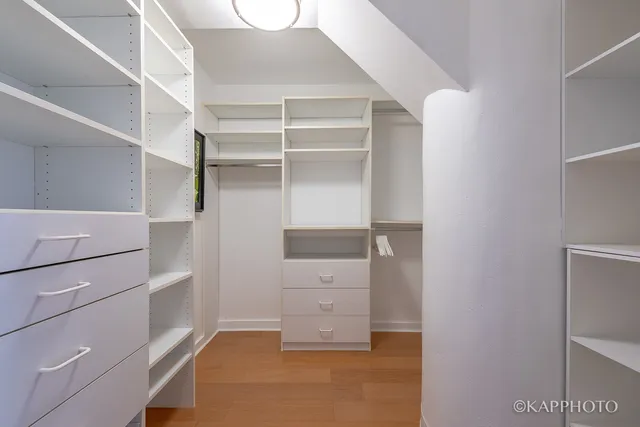a view of an empty walk in closet