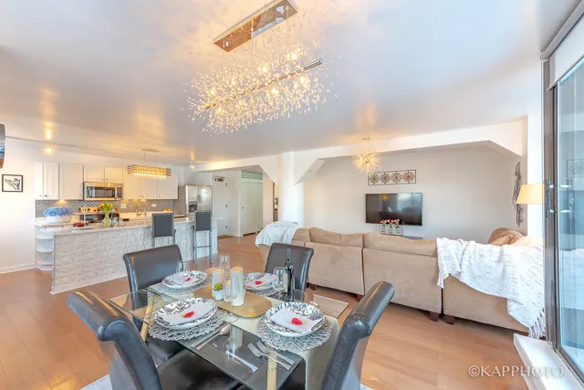 a large kitchen with a table and chairs
