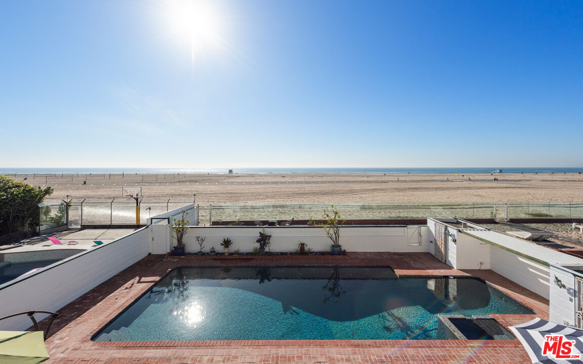 605 Palisades Beach Road Santa Monica, CA 90402 - Photo 16 of 33 a view of a swimming pool and lounge chair