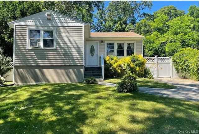 a front view of house with yard