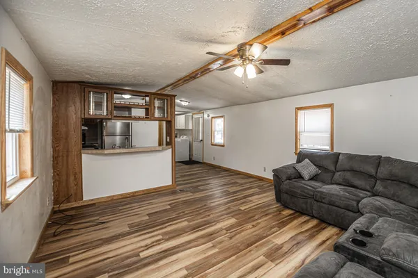 a living room with furniture and a window