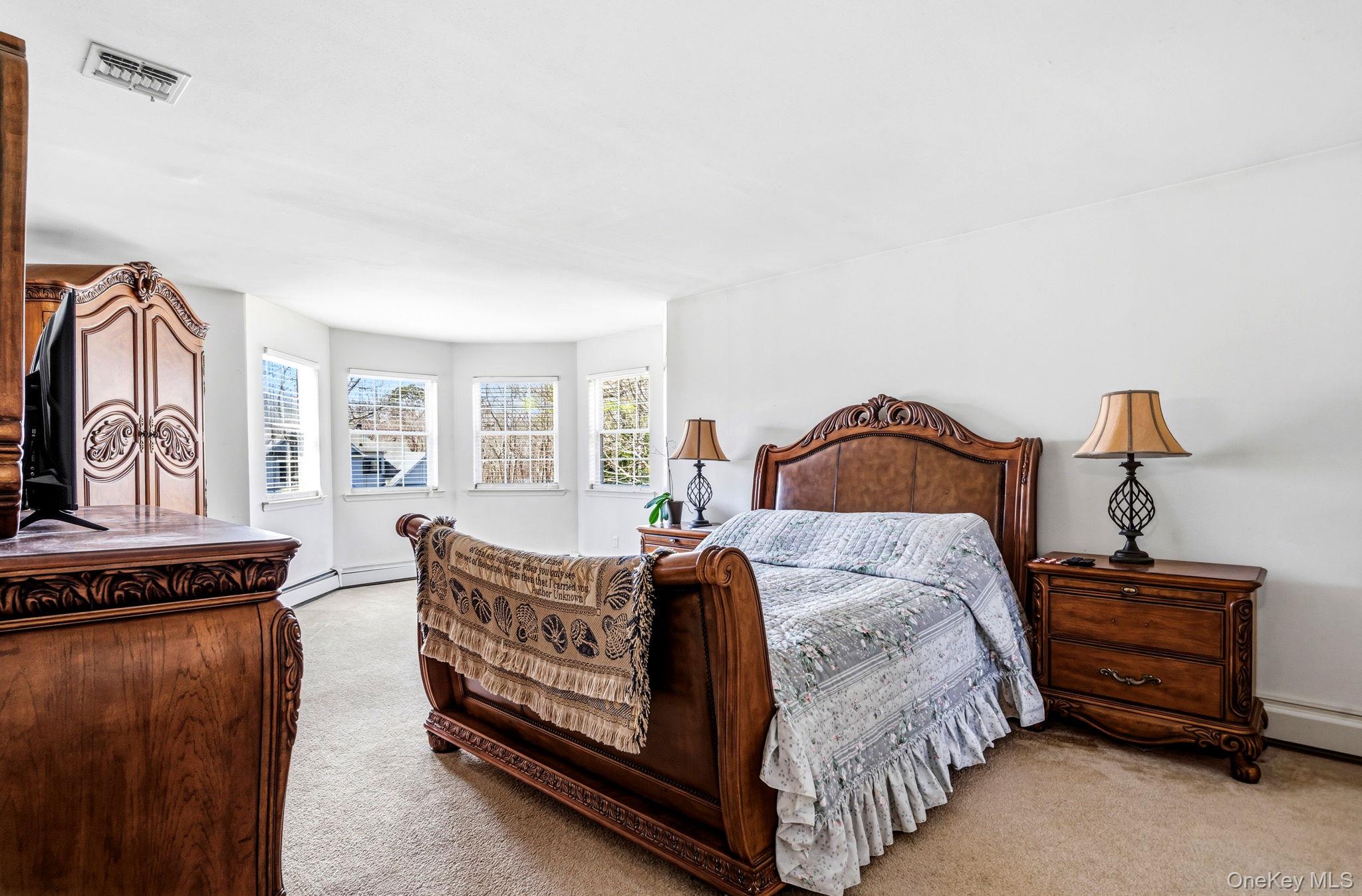 20 Ricky Road Manorville, NY 11949 - Photo 18 of 27 a bedroom with bed and window