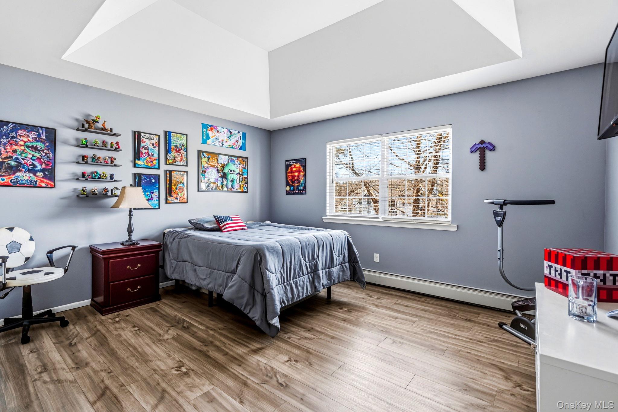 20 Ricky Road Manorville, NY 11949 - Photo 22 of 27 a bedroom with a bed dresser and a window