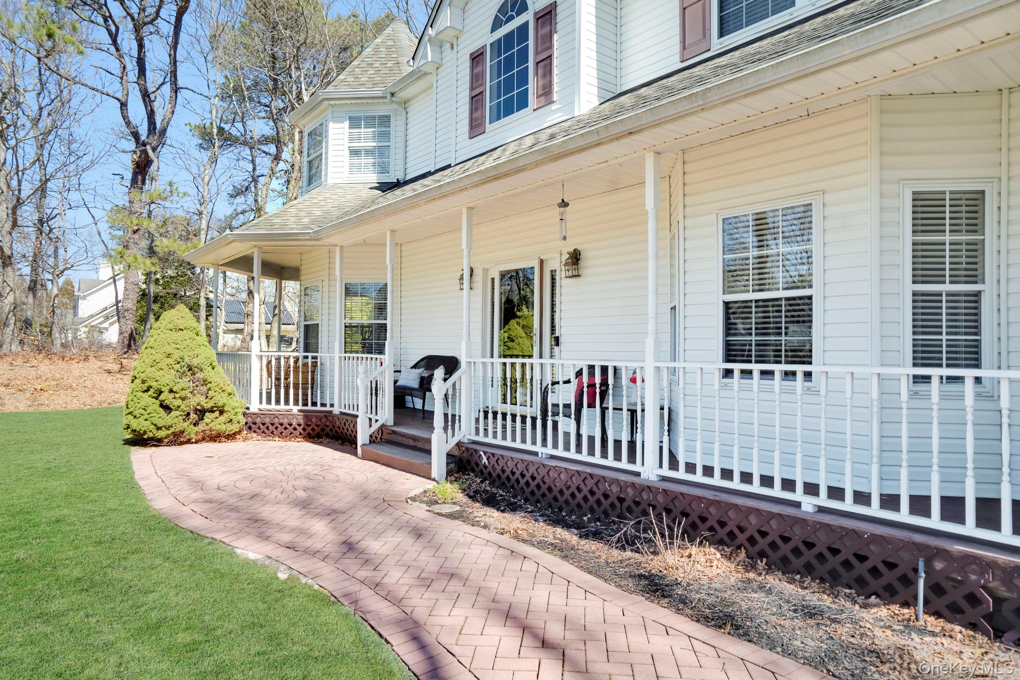 20 Ricky Road Manorville, NY 11949 - Photo 3 of 27 a view of a house with backyard and porch
