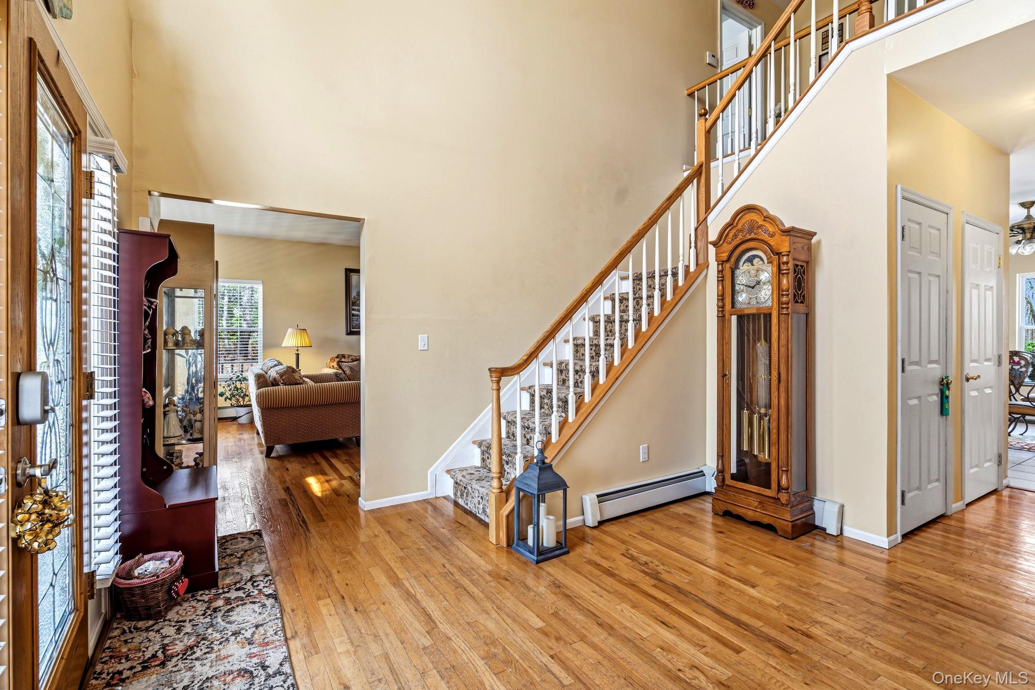 20 Ricky Road Manorville, NY 11949 - Photo 4 of 27 a view of entryway and hall with wooden floor