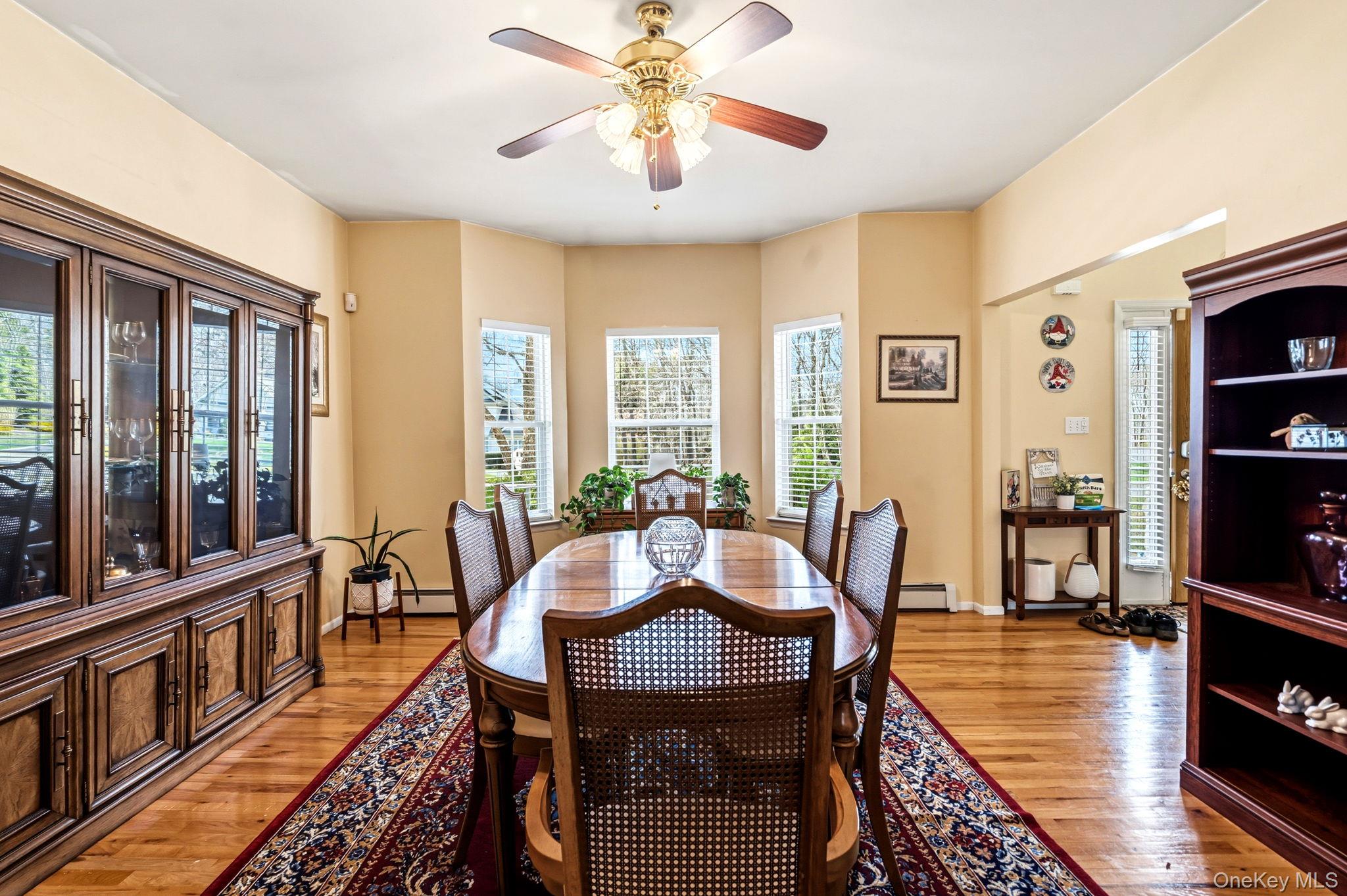 20 Ricky Road Manorville, NY 11949 - Photo 7 of 27 a view of a dining room with furniture window and wooden floor