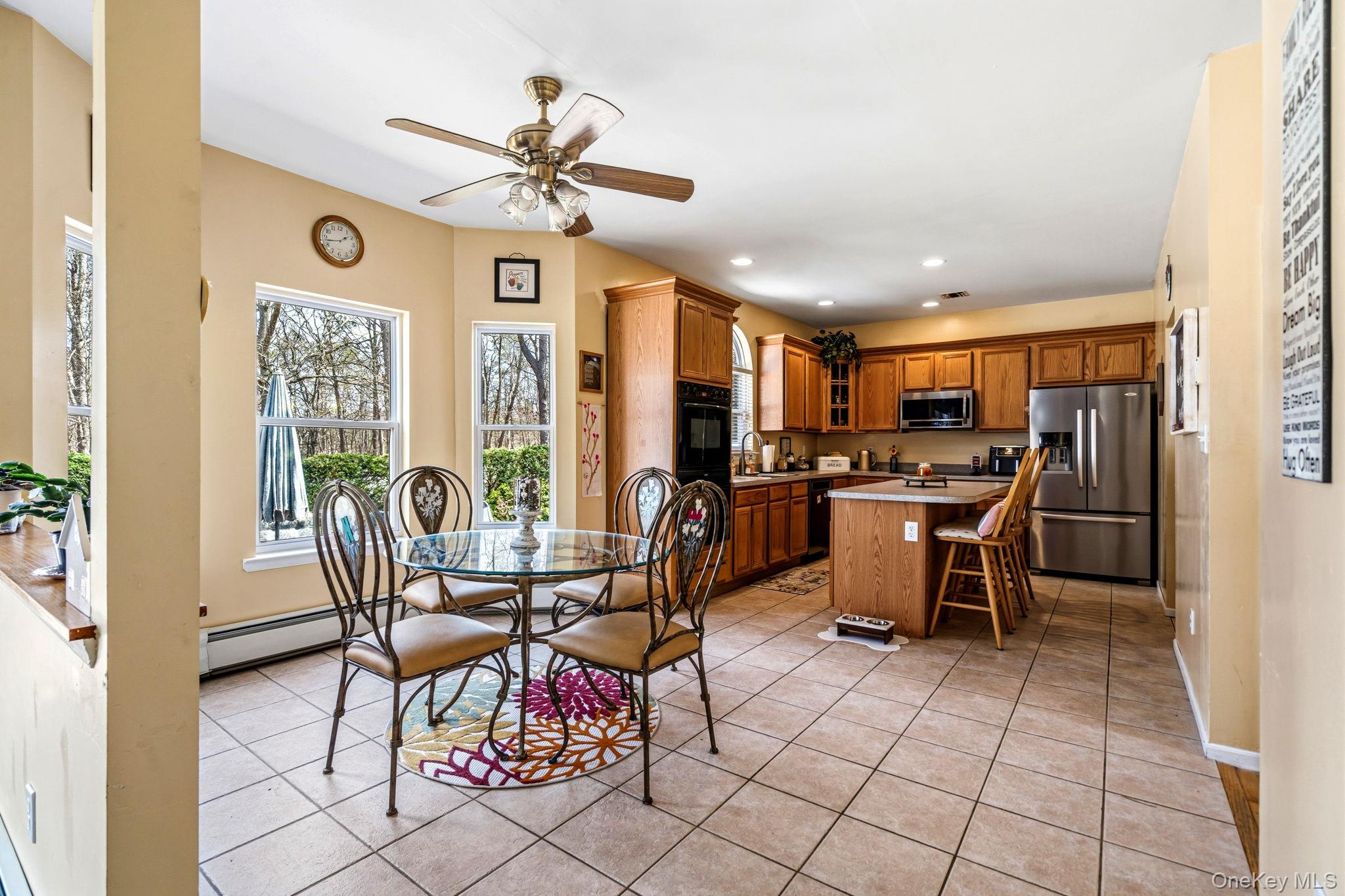 20 Ricky Road Manorville, NY 11949 - Photo 9 of 27 a view of a dining room with furniture window and outside view