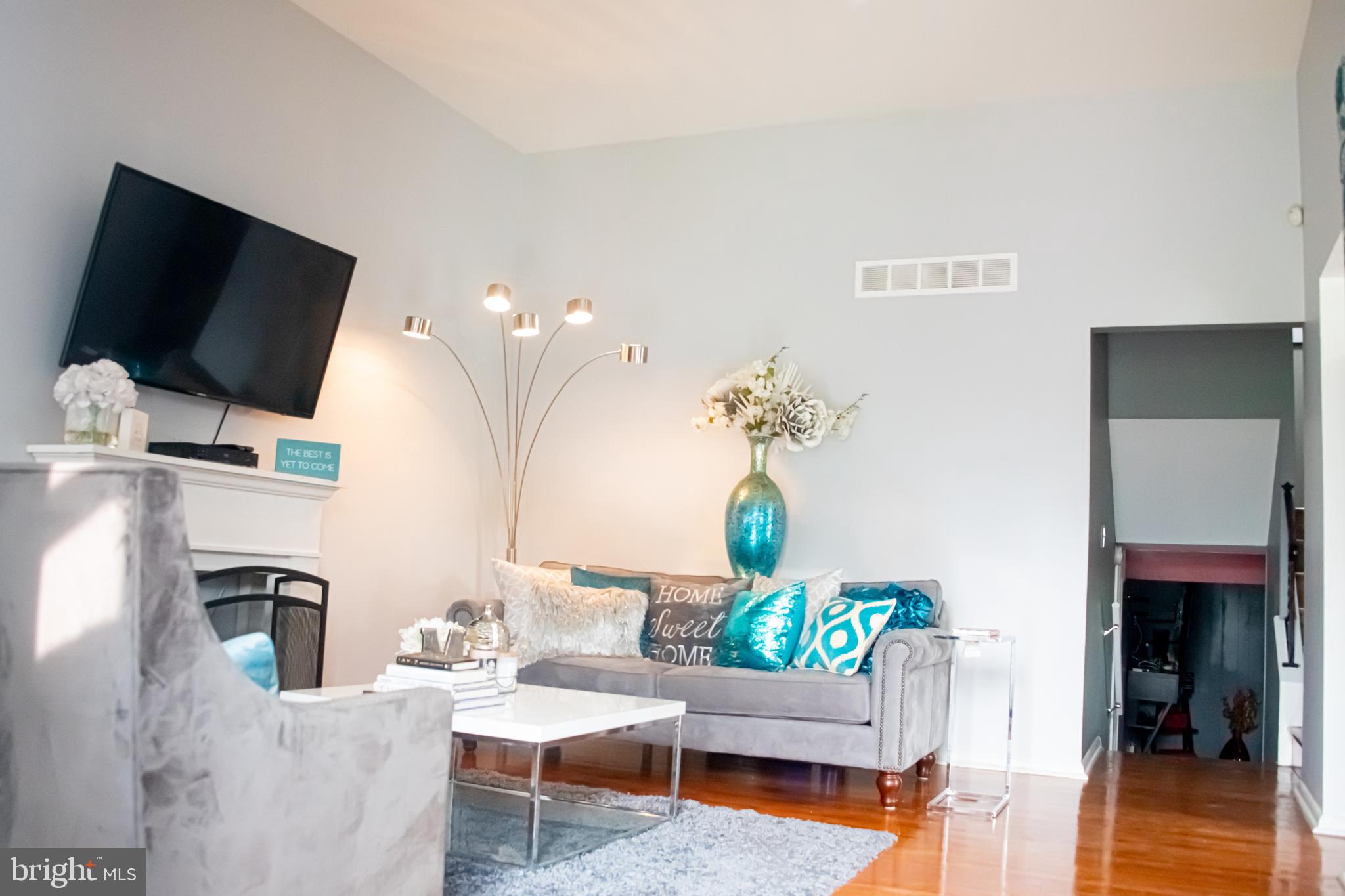 3403 Keston Road Baltimore, MD 21207 - Photo 5 of 36 Living room w/ hardwood floors & vaulted ceiling.