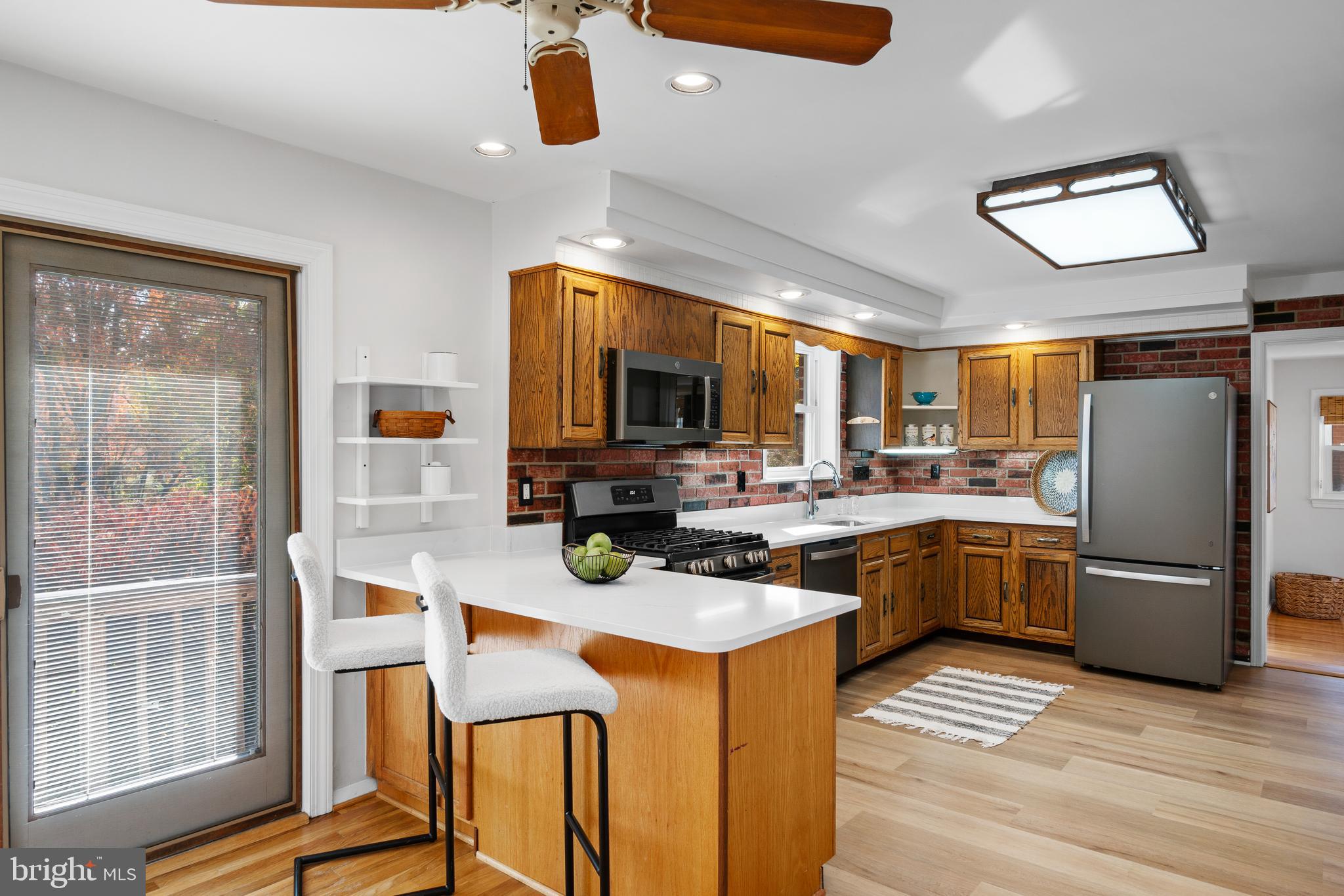3504 Falling Green Road Olney, MD 20832 - Photo 16 of 54 a kitchen with a sink stainless steel appliances and counter space