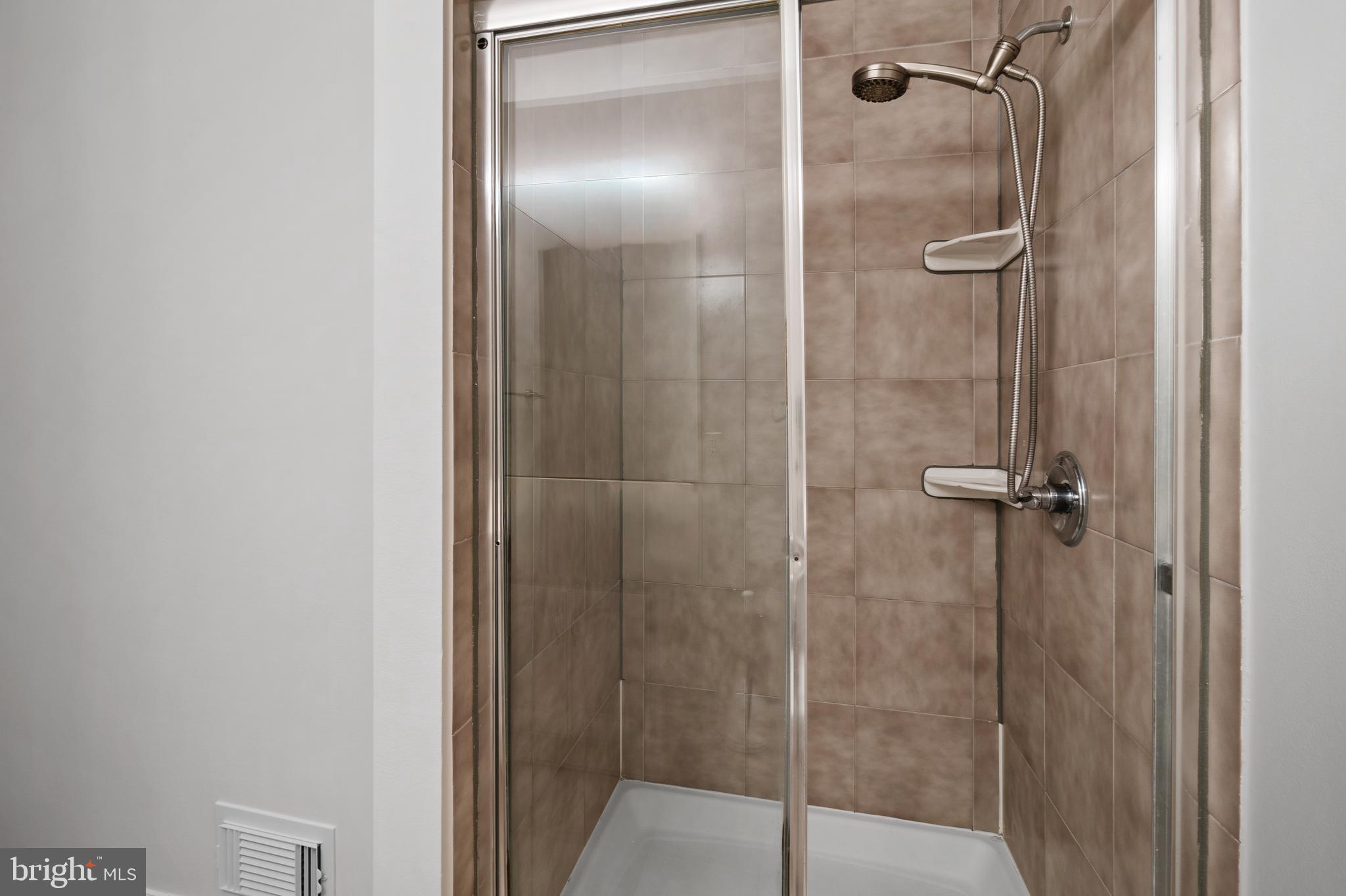 3504 Falling Green Road Olney, MD 20832 - Photo 24 of 54 a bathroom with a glass shower door