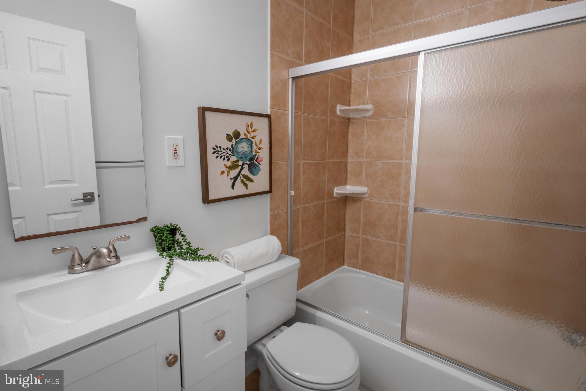 3504 Falling Green Road Olney, MD 20832 - Photo 28 of 54 a bathroom with a sink toilet and shower