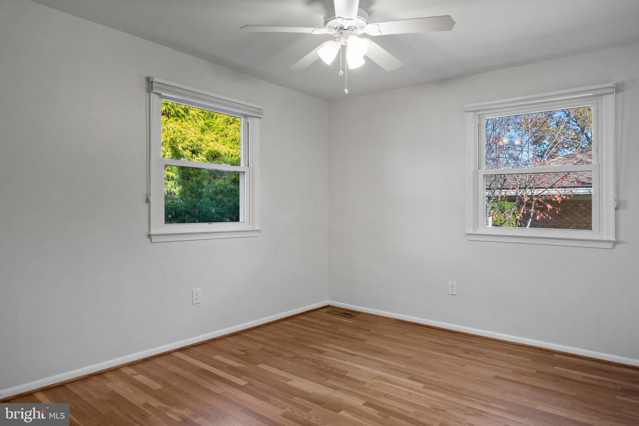 3504 Falling Green Road Olney, MD 20832 - Photo 30 of 54 a view of an empty room with wooden floor and a window