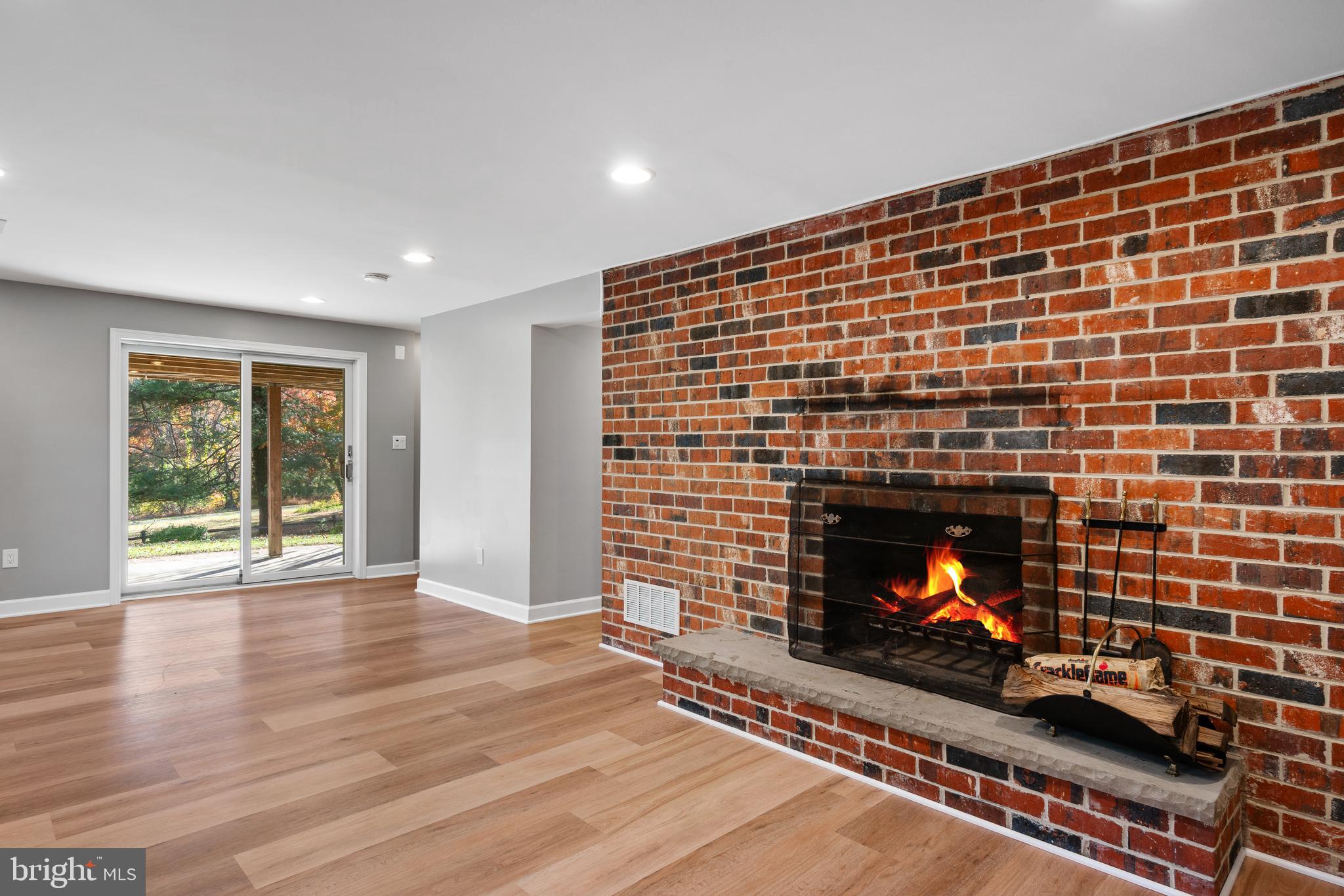 3504 Falling Green Road Olney, MD 20832 - Photo 32 of 54 a living room with furniture and a fireplace