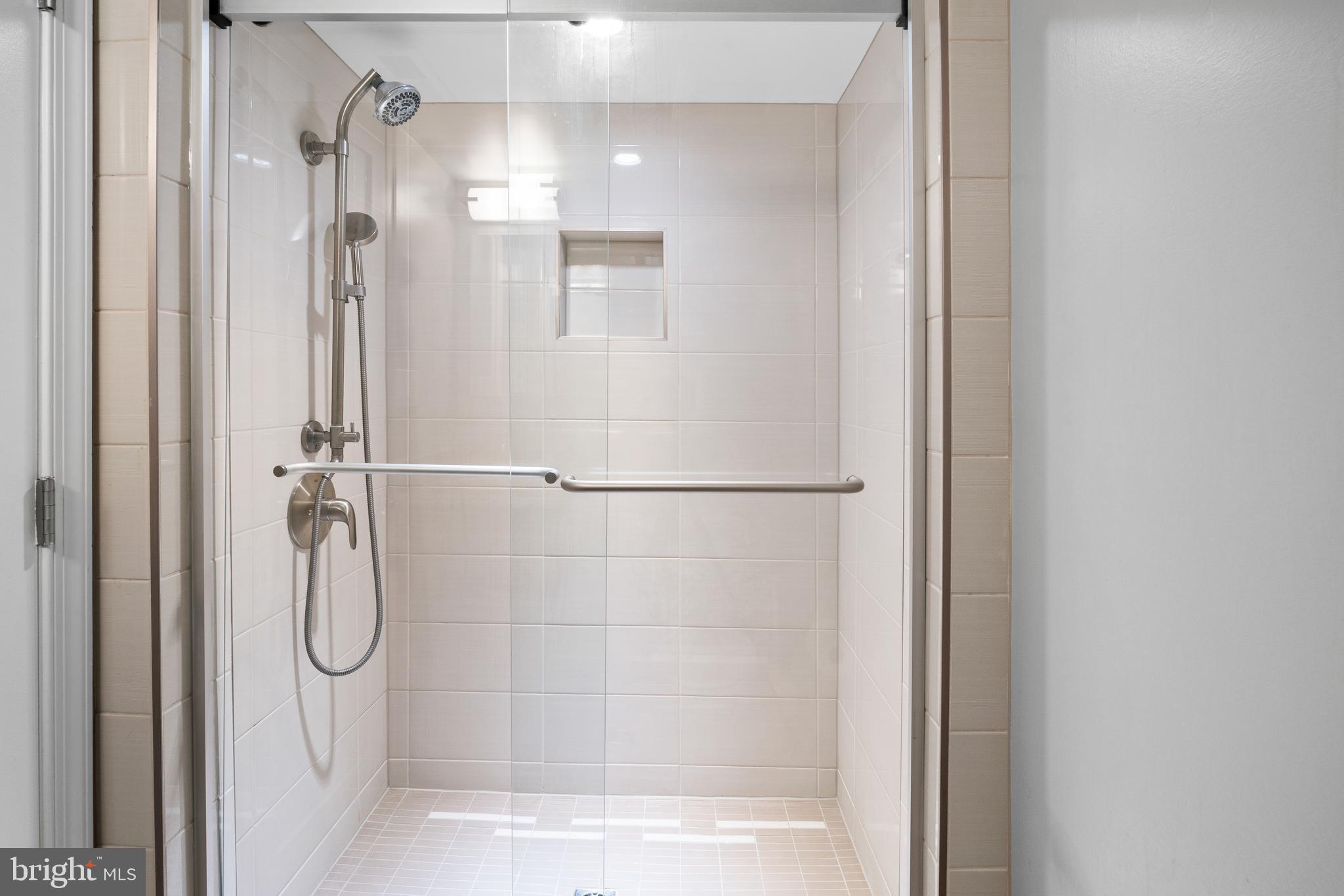 3504 Falling Green Road Olney, MD 20832 - Photo 37 of 54 a bathroom with a glass shower door