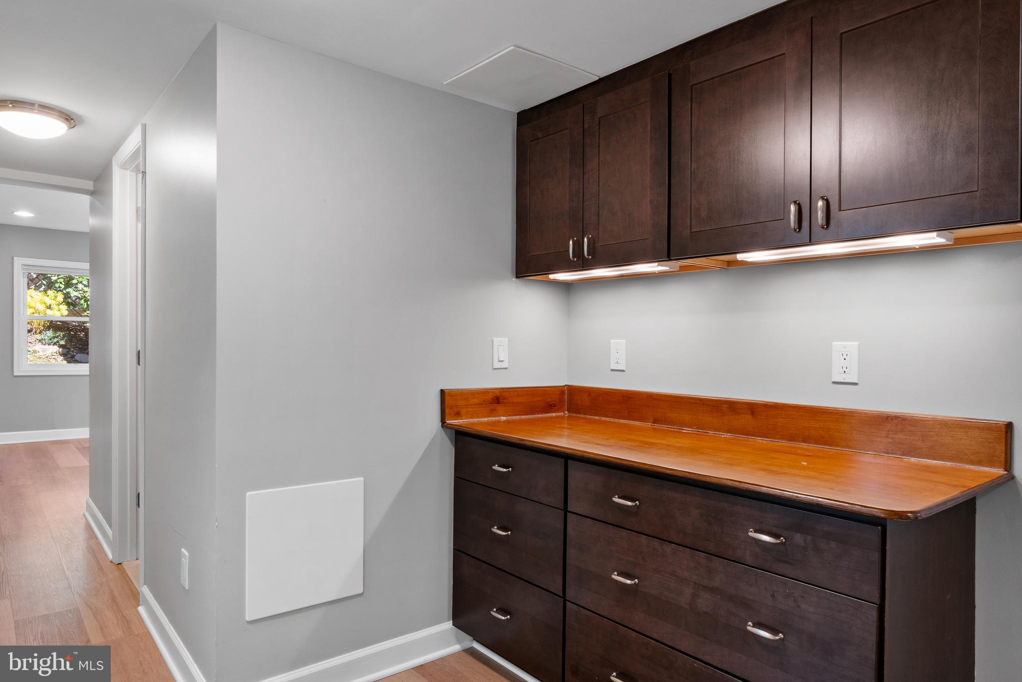 3504 Falling Green Road Olney, MD 20832 - Photo 38 of 54 a room with stainless steel appliances cabinets and wooden floor