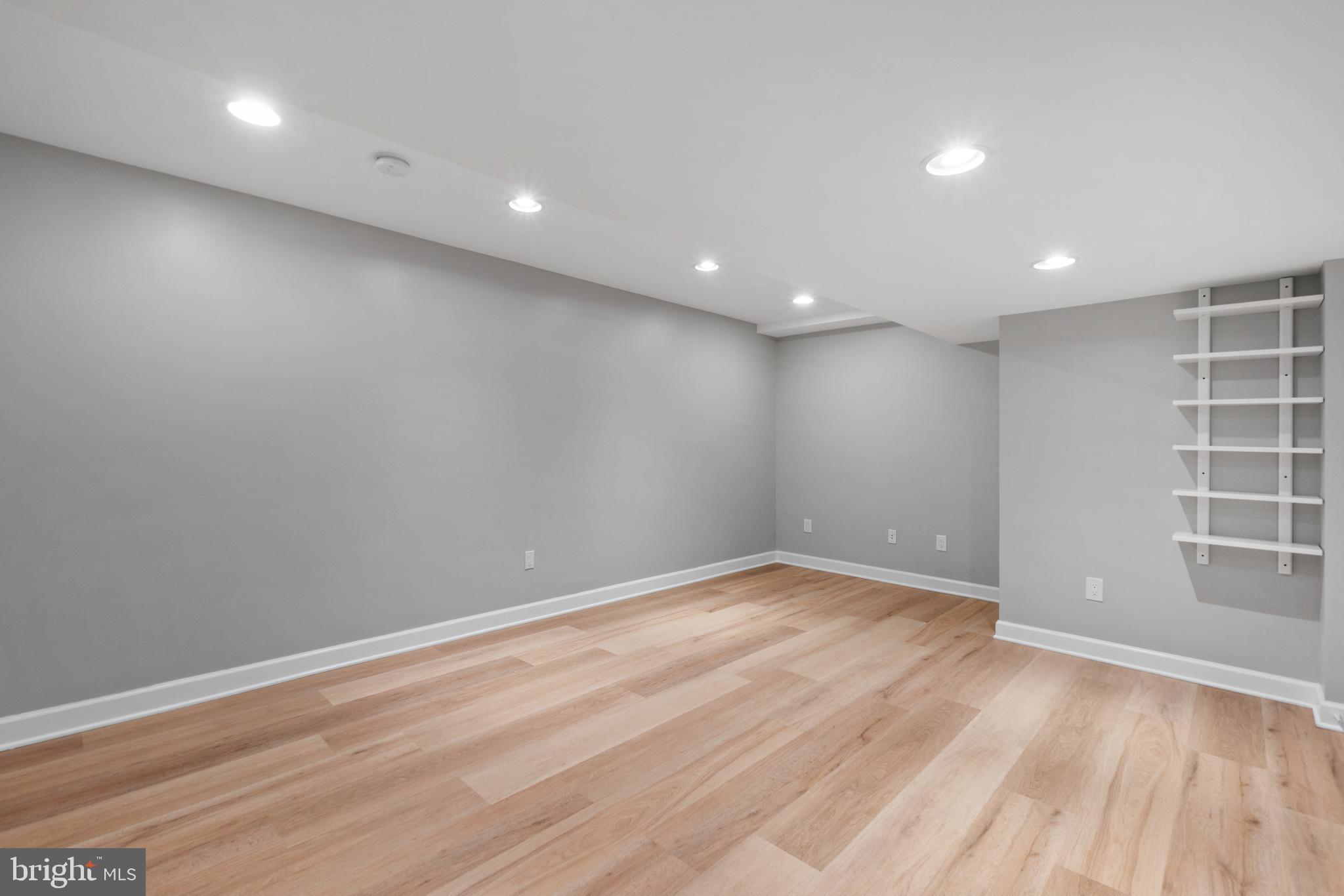 3504 Falling Green Road Olney, MD 20832 - Photo 39 of 54 an empty room with wooden floor and windows