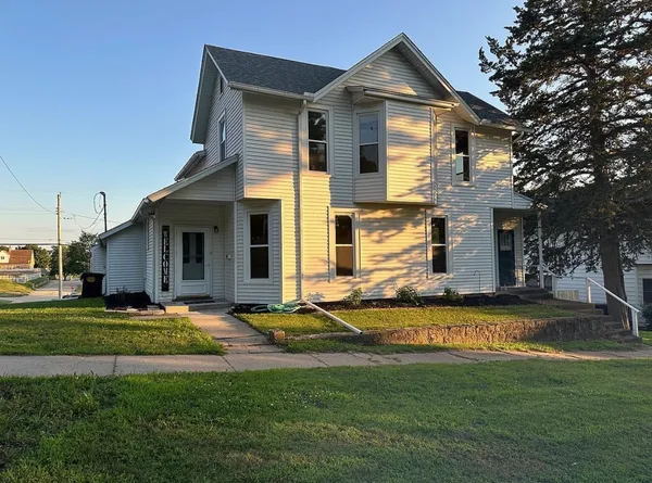 a front view of a house with a yard